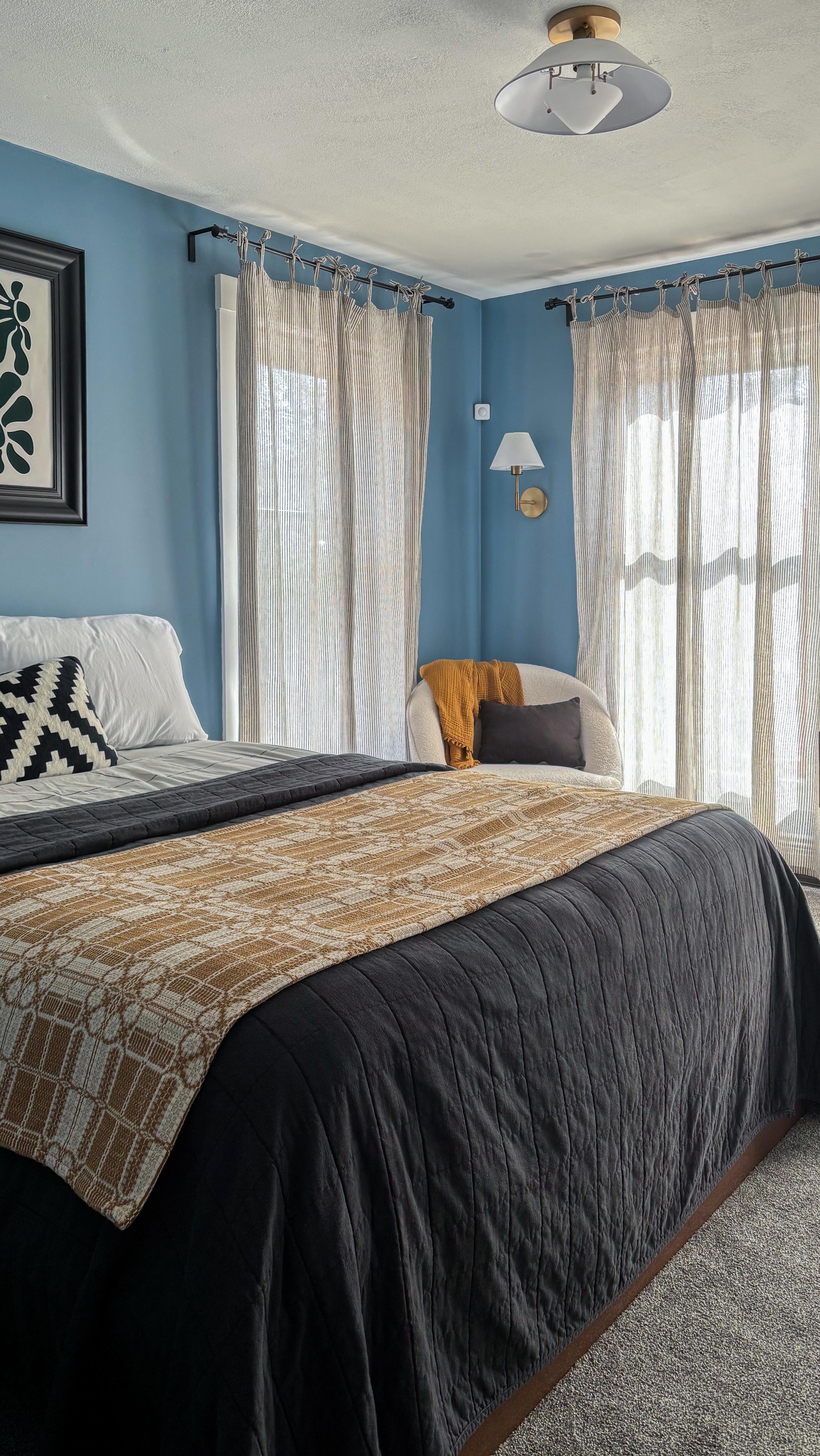 Welcome to my guest room 🛏️
I’ve been slowly curating this room over the last few months and I’m really happy with it now.
I admire designers who play with lots of colors and patterns and want to push myself to be better at that, all while keeping within a simple budget.
Besides paint, the only things I purchased for this room was the curtains, the art (not the frame) above the bed, and the flushmount light. Everything else I had on hand and slowly switched around until I found the right combination.
I imagine I’ll add a few more textures and layers at some point, but I’m really please with this sunny & comfortable space. What do you think?
#interiordecorators #interiordesignersofinstagram #edesigner #guestroom #bedroomdesignideas