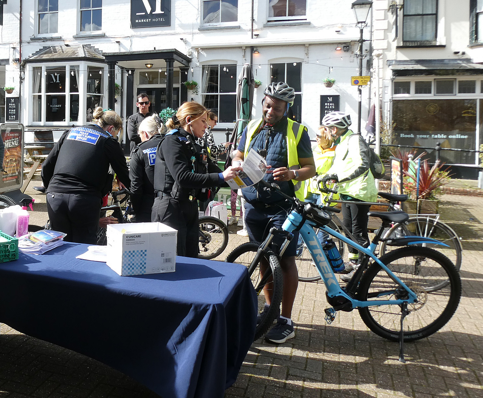 We held our very successful 'Celebration of Cycling' in the Market Square yesterday, in full sunshine but with a chilly wind. This was held in conjunction with Walk Alton to celebrate the launch of our new joint map and our new website.
Five groups of cyclists rode in from different locations around the town, and were joined by the Cycling UK Alton Saturday morning riders, as well as numerous others who found their way there.
On arrival in the Market Square cyclists were greeted by Alton Town Mayor Cllr Annette Eyre, and Chair of East Hampshire District Council Cllr Graham Hill. We thank them both for attending and saying a few words about Cycle Alton and active travel in the area.
Free and half-price refreshments were available from local establishments and Alton's Community Cupboard. Many cyclists took advantage of some bicycle maintenance from Hilary and Leon, as well as having their bikes security-marked by three Hampshire PCSOs, who reported a total of 37 bikes had been marked, as well as numerous security stickers given out.
We thank everybody who gave up their time to make this event a success!