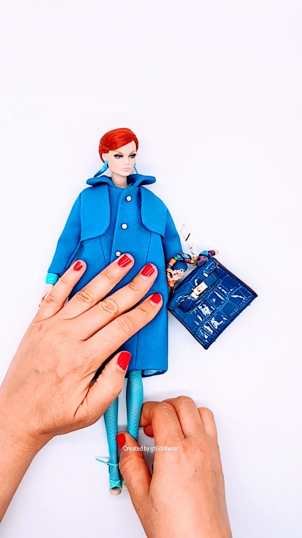 Blue mod coat, fishnets, matching sandals and bag — the full mod moment.
I always laugh because every time I post a look like this, the collectors appear faster than my mum when she spots anything remotely 60s. She grew up in the mod era, so she claims this is “proper fashion,” and honestly… she might be right.
There’s a reason these mod vibes are so popular: they’re the era so many collectors remember with real affection. The clean lines, the bold colour, the effortless cool — it hits that nostalgia button in the best possible way. It’s familiar, it’s joyful, and it brings back the kind of fashion energy that never really left.
I design these pieces with intention and a lot of respect for the era — even if I didn’t grow up in it myself, I grew up hearing about it from someone who absolutely did.
Some styles are trends.
Mod is a memory — and that’s why it always wins.
#gtGdollwear #integritytoys #poppyparker #integritydoll #integritytoyscollector