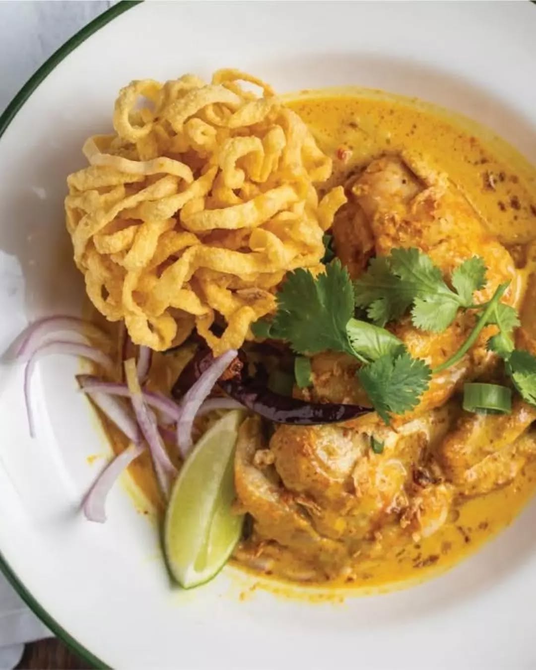 A bowl that does the heavy lifting! 🍜🔥
Our Chiang Mai Chicken Curry Noodles bring that northern Thai comfort; rich curry broth, tender chicken, lime, dried chilli, herbs and crispy shallots piled over egg noodles.
Which bowl are you going for today? 👀 Book your table via the link in bio!
#PokPokJunior #ThaiFoodMelbourne #MelbourneCBD #MelbourneLunch #AsianStreetFood