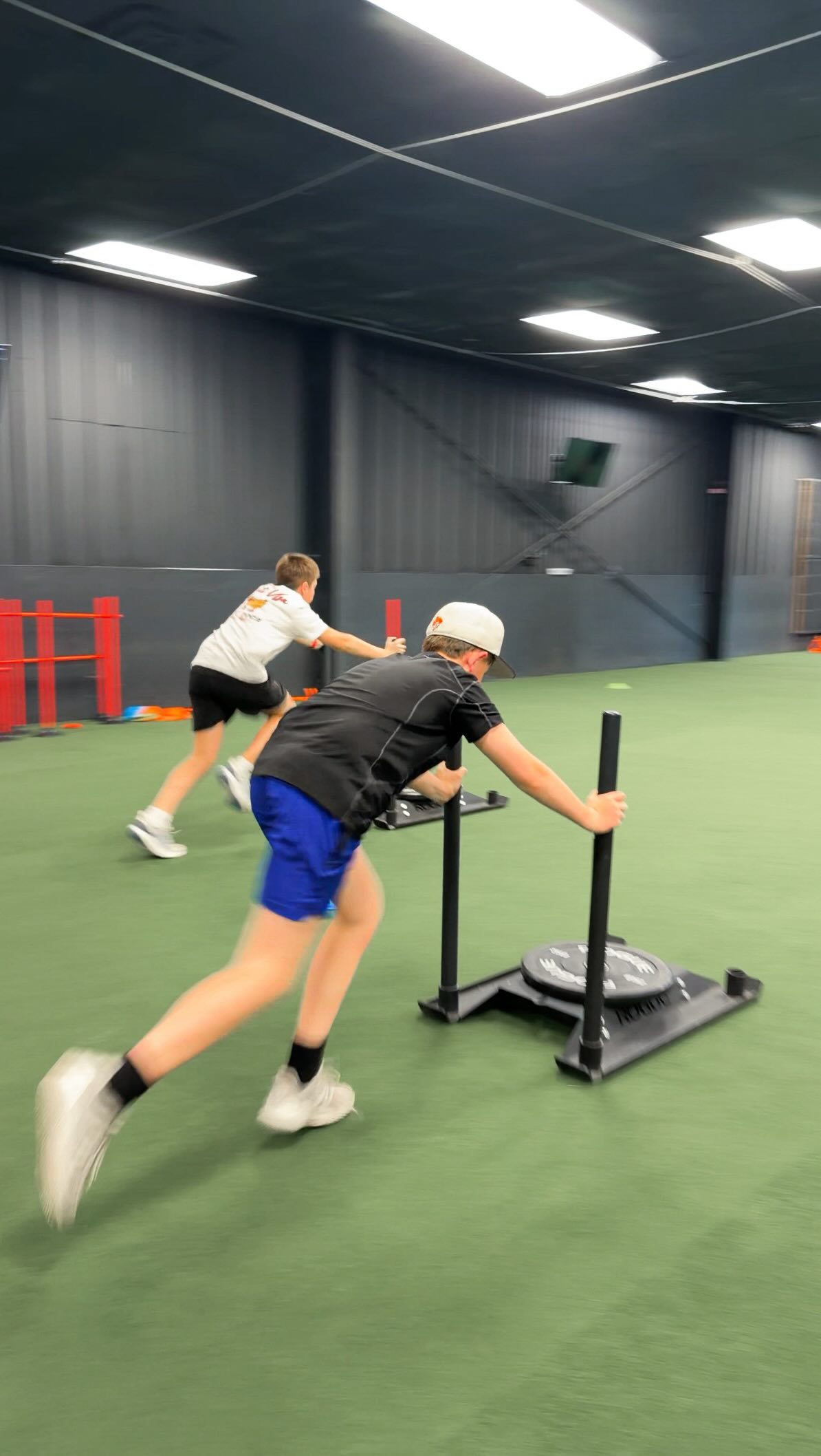 Acceleration and lower-body strength development for athletes across all sports. Resisted sled sprints and backward sled drags focused on force application and powerful movement.