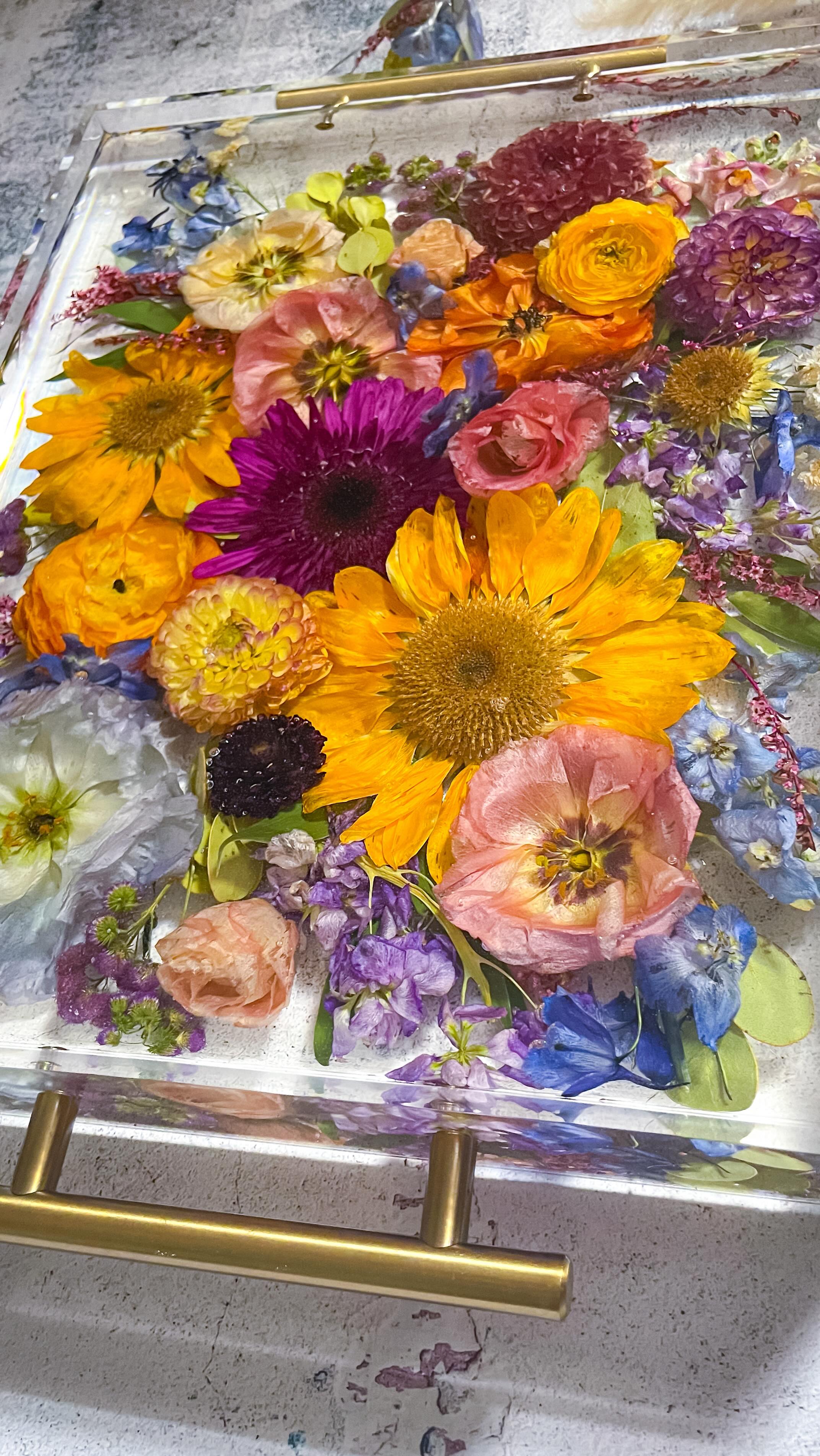 I love the sentiment behind this piece. I sent two design options to this couple in case they wanted to include more blooms, but they chose to keep the sunflowers for a sentimental reason, which I absolutely adore💛
I love how this piece came together: simple, timeless, and classic.
I’ll always design with your direction you choose in the order form but I’ll include an additional design option in your complimentary design if I feel it gives you something extra to consider✨
#floralpreservation #bridalbouquet #resinart #weddingvendor #resinflowers