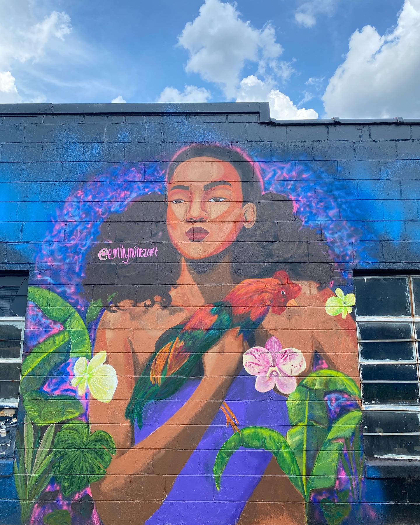 Located 📍2408 North Tryon St Charlotte NC, 28206
My piece for peace mural, Cerca De Mi Corazón🤎
“Peace, for me, is a feeling of contentment within my own space. This mural speaks to my heart, depicting a Dominican woman tenderly holding a chicken surrounded by the beauty of nature. It transports me back to those warm moments with my family, where we’d gather together, surrounded by the comforting sights and sounds of our backyard. The gentle breeze blowing through the leaves as we lost ourselves in the rhythms of salsa music, while the chickens roamed freely, adding to the scene. It’s a reminder of the deep sense of peace and belonging that washes over me in those precious moments of connection and calmness.”
@pieceforpeace_movement
