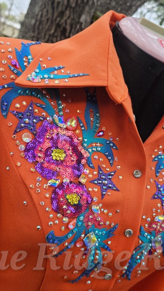 New shirt! Orange base with iridescent sequin florals, hand painted leaves, metallic stars and stones! Obsessed!!
Www.rodeoqueenclothes.com
#rodeoqueen #rodeoqueenfashion #rodeoqueenshirt #OneOfAKindStyle #cowgirlstyle