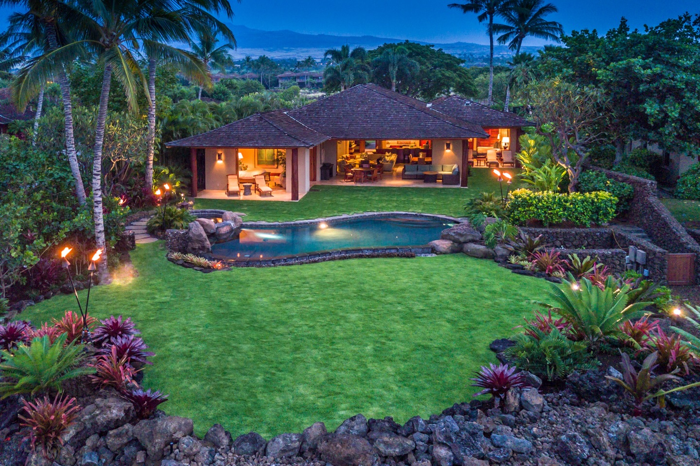 At Kema Kama, we don’t simply list vacation homes. We hand-select each one with the care of someone choosing a future family heirloom. If you’re the kind of traveler who values privacy, effortless luxury, and a true sense of belonging, this process is designed with you in mind.
Hualalai Resort is already one of the world’s most prestigious gated communities on Hawaii’s Big Island. But not every home inside its gates meets our standards. Our team—rooted in more than 20 years of on-island expertise—walks every property, studies every view, and imagines every moment you might spend there. We look for homes that feel like a private sanctuary rather than a rental. That means infinity pools that frame the ocean just right, lanais where the trade winds carry the scent of plumeria, and layouts that invite quiet conversations or easy multi-generational gatherings.
These aren’t random listings. They are the result of years of relationships with owners, constant evaluation of standards, and an unwavering commitment to only presenting homes that deliver the Kema Kama distinction: flawless attention to every detail so you arrive as a welcomed guest and leave as ohana.
In a world of endless online options, this curation is what sets us apart. We’re a small, local Hawaii company—not a global portfolio managed from afar. That personal touch means we know which homes truly feel like yours the moment you step inside.
If you’re dreaming of a Hualalai escape that feels exclusive, intimate, and perfectly suited to you, we invite you to explore our collection. Because the right home isn’t just about luxury. It’s about the feeling that someone finally understood exactly what you were looking for.