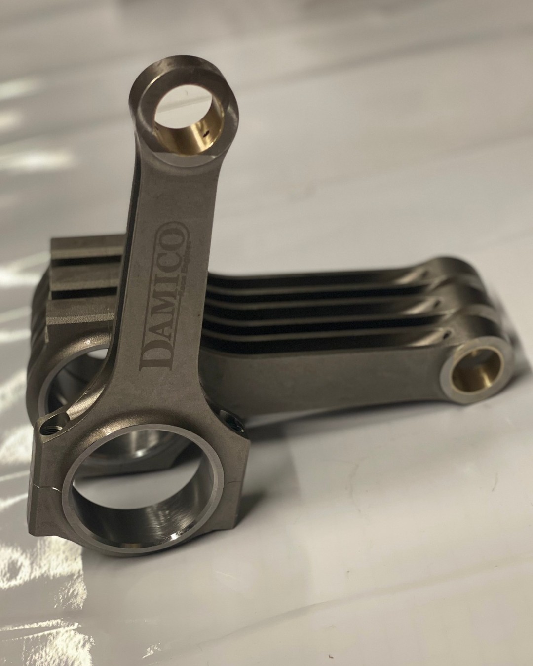 **Mini F56 B48A Forged Con rods**
Our super forged con-rods have been customised to Damico Engines specifications and produced solely for Damico; they include:
- Made from ultra high stength 4340 steel
- Heat treated: HRC34-38
- Extra shot peening
- Balanced within 1g
- Phosphor bronze bush
- Supplied with ARP2000 bolts
As used in Andy Hawes @ahawesracing - Time Attack Challenge Mini F56 and weighing 30g less when recently compared to competitors rods, this dramatically reduces the load on the crankshaft and bearings above 5000RPM.
Other Damico customised products for the F56 B48A engine as used in Andy Hawes @ahawesracing Time Attack Challenge and the Mini Challenge JCW class include:
- Forged pistons
- Oil cooler take off plate with -10JIC fittings.
Posts regarding these items will follow shortly.
We also stock a large quantity of parts for the F56 B48A engine usually same day dispatch before 1pm.
-------------------------------------------------------
Want to get in touch? We would love to hear from you.
Here is how you can reach us...
Call Us: +44 (0)1953 717 784
Email: info@damico-engines.co.uk
Instagram: www.instagram.com/damico_engines_ltd
Web: www.damico-engines.co.uk
#minif56jcw #johncooperwork #f56jcw #modifiedf56 #f56_ownersclub #minichallengeuk #minif56forum #minif56coopers #miniowners #f56 #jcw #mini #racecar #excelr8motorsport #gravesmotorsport #hybridtune #jcwmafia #minichallenge #jcwchallenge #minicooperjcw #minicooper #jcwcooperworks #johncooperworks #snettertoncircuit #snetterton300 #f56s #f56miniclub #f56minicooper TAROX Brakes DervTech Tuning Bilstein UK Whiteline Garage34 Tylah Motorsport