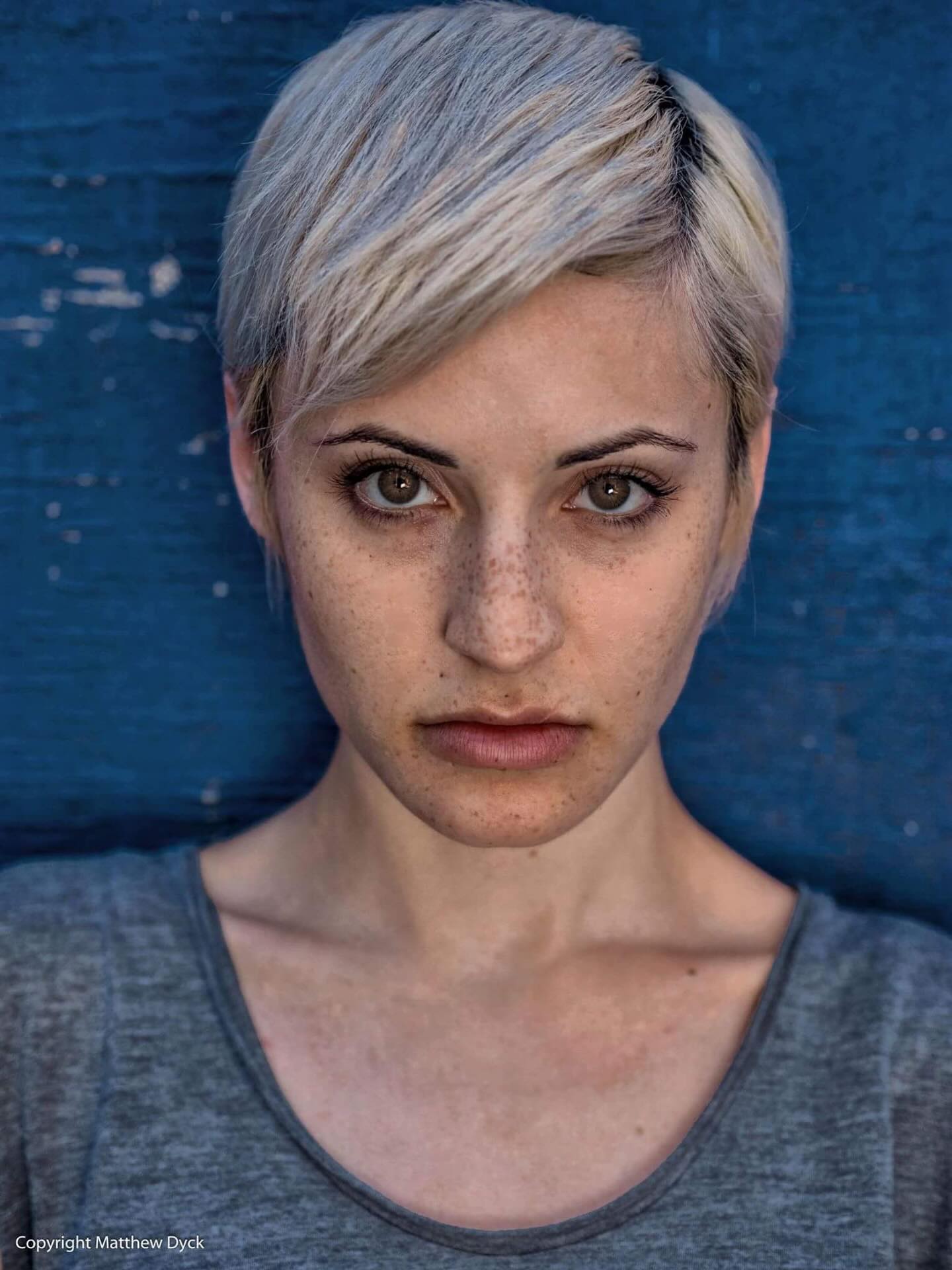 Sometimes life redraws your outline overnight, new hair, new name, new chapter, same heartbeat. The mind keeps asking, “Who is this person now?” Non‑duality shrugs and says, “The same one who was the child, the teenager, the stranger on the street. Forms change, blue walls peel, faces soften and lift, but the looking itself has never grown old.” #portraitphotography #streetportrait
#outoftheblue #everydaypeople
#matthewdphoto