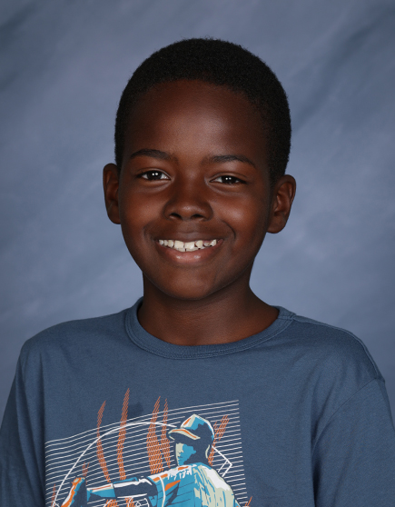 Student spotlight! This is fifth grader Kalem Hendricks’ first year as part of the GHS community. He says he likes the way our teachers teach and that students get to do fun activities in class. Kalem particularly enjoyed fifth grade’s spring STEAM Week activity, which challenged the students to engineer a prototype for an original invention.
“Kalem has blended very nicely into the fifth grade class,” says fifth grade teacher Ms. Christina. “He’s a good, loyal friend. His classmates gravitate to him because he’s an all-around good person.”
“Kalem has made some really awesome academic gains since he started at GHS,” adds Lower Campus learning strategist Ms. Lenny. “He works really hard and he always has a good attitude. He’s got an amazing work ethic and is very responsible.”
Kalem says his classmates were welcoming and that they help him with his schoolwork. PE is his favorite special because he enjoys the activities, especially capture the flag.
“Kalem is always excited to get his homework done,” says Ms. Lenny. “He keeps up with assignments and knows what’s due and when it’s due. His attitude really serves him. He’s polite and respectful with adults and is able to laugh and make jokes with his classmates.”
Kalem is a member of our elementary basketball team. In his free time, he enjoys being outside and riding bikes.