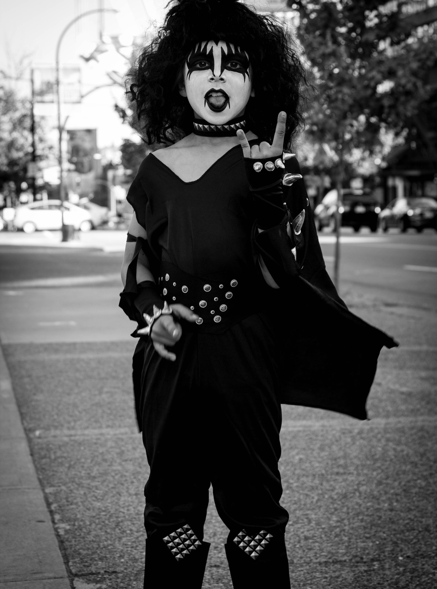 Some kids dress up as firefighters or princesses. This one chose platform boots, studs, and a city sidewalk as the main stage. Tiny body, giant swagger, already fluent in the ancient language of “I am exactly who I say I am.” If you forgot how to take up space today, let this small rock god remind you: you’re allowed to turn the volume all the way up.
#streetportrait #streetphotography
#blackandwhitephotography #kissarmy #matthewdphoto