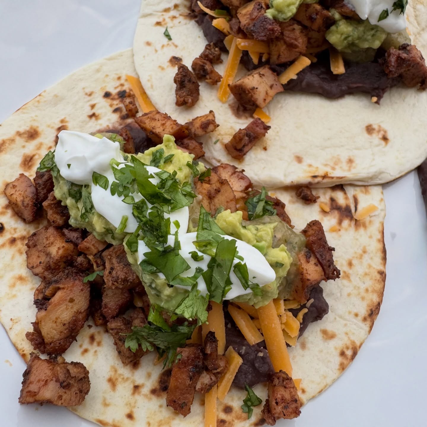 Smoked Chicken Tacos 🌮 After near 8 months, I finally have a new recipe up bc so many of yall wanted this one. I haven’t even taken good photos yet, but I promise, these tacos are OUTSTANDING. They’re great for any occasion- we made these for dinner one night while hosting over night guests and they were a huge hit. Grab the recipe in the link in my bio or swipe for a screenshot. @traegergrills ftw here! #food #cooking #recipes #tacos #delicious