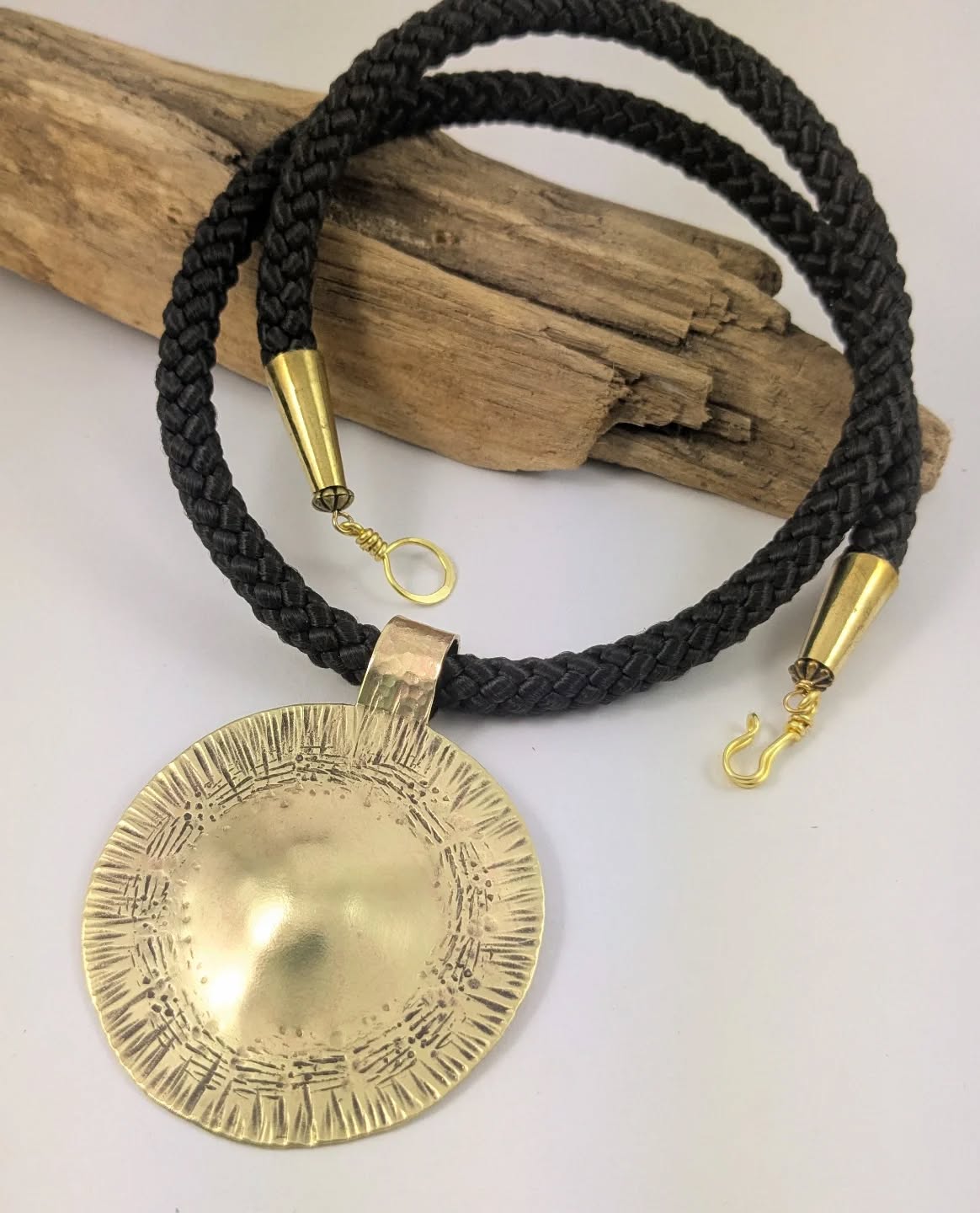 Hand forged Bronze 'gong' Pendant
#metalwork #metalstampedjewelry #hammered #handmadejewelry #tribaljewelry