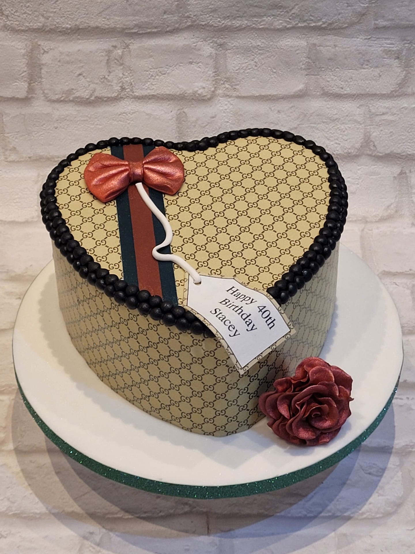 Elegance wrapped in every detail ✨
This luxury heart-shaped celebration cake is all about timeless sophistication - inspired by an iconic design style and finished with a flawless edible monogram printed wrap that brings every detail to life. Paired with a statement bow and a personalised touch for a special 40th birthday. 🎀
Because turning 40 deserves nothing less than something truly unforgettable.
#LuxuryCake #DesignerCake #40thBirthdayCake #EdiblePrint #cakedesign