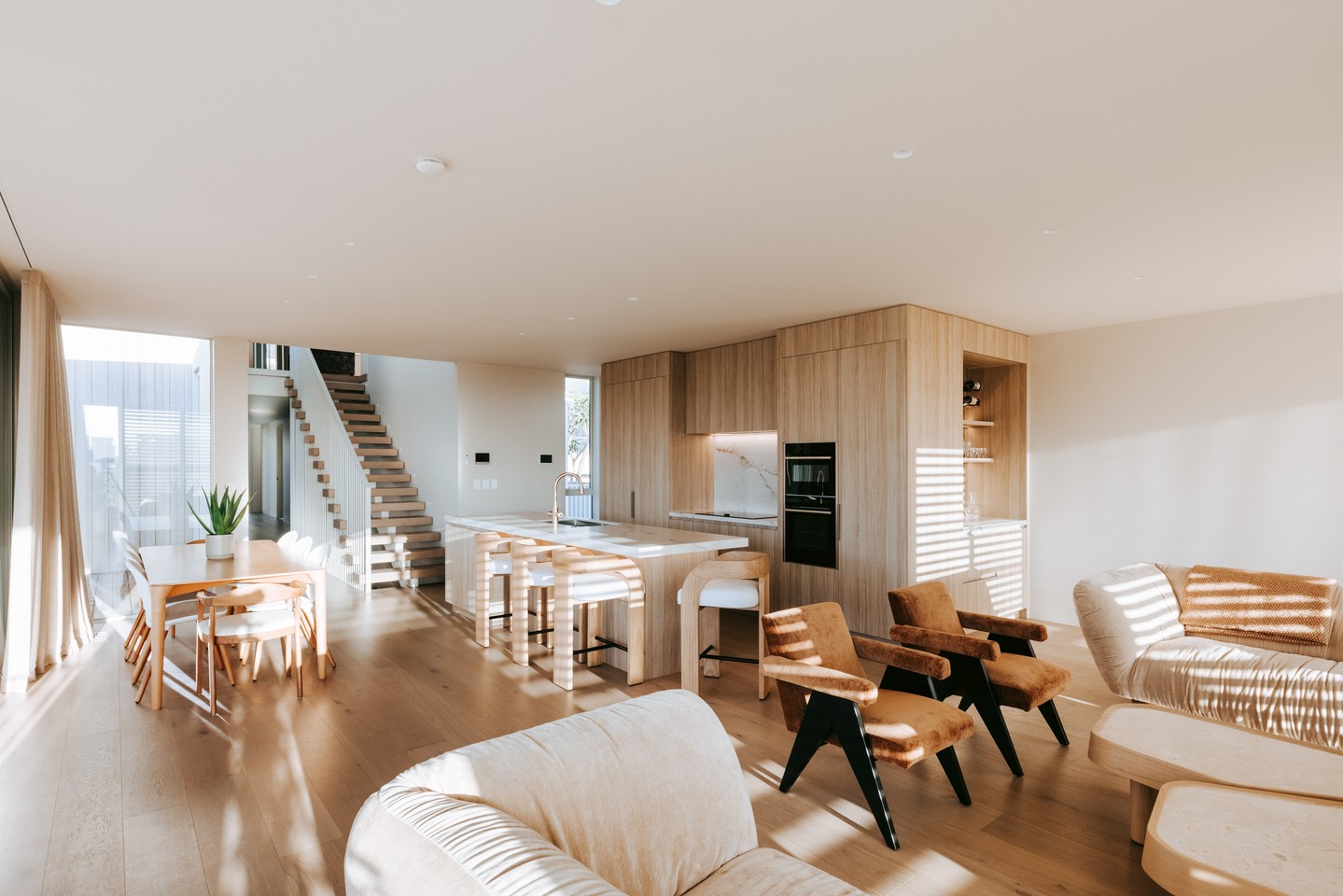 Long weekends were made for spaces like this.
Kitchen, dining, and lounge areas flow together beneath a calm architectural framework, with the stairwell introducing a strong vertical moment within the composition. If the weather plays its part, stacking sliders open the entire space to the outdoor seating areas, extending daily living beyond the interior.
A perfect setting for hosting friends and family this Easter 🐣
Explore the full Coastal Modernist project via the link in bio.
Architecture: @carnachan_architecture
Interiors: @shawdesign.nz
Kitchen: @vekartnz
Photography: @boundlessvisionnz
#CalleyHomes #CoastalModernist #OpenPlanLiving #IndoorOutdoorLiving #ArchitecturalHomes #ModernCoastal #DesignAndBuild #NZArchitecture #LuxuryHome #NZBuilder