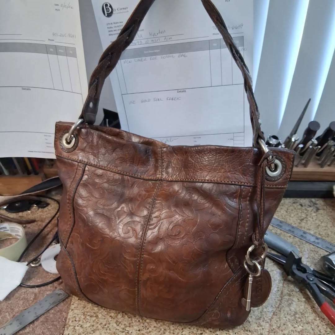 Before and after shots of a customers Fossil Hobo Winslet shoulder bag. She had taken it to a leather repair shop to fix the liner and they butchered it. All new foil accented cotton liner with tags replaced. #luxury #luxuryhandbags #fossil #fossiladdict #leatherrepair