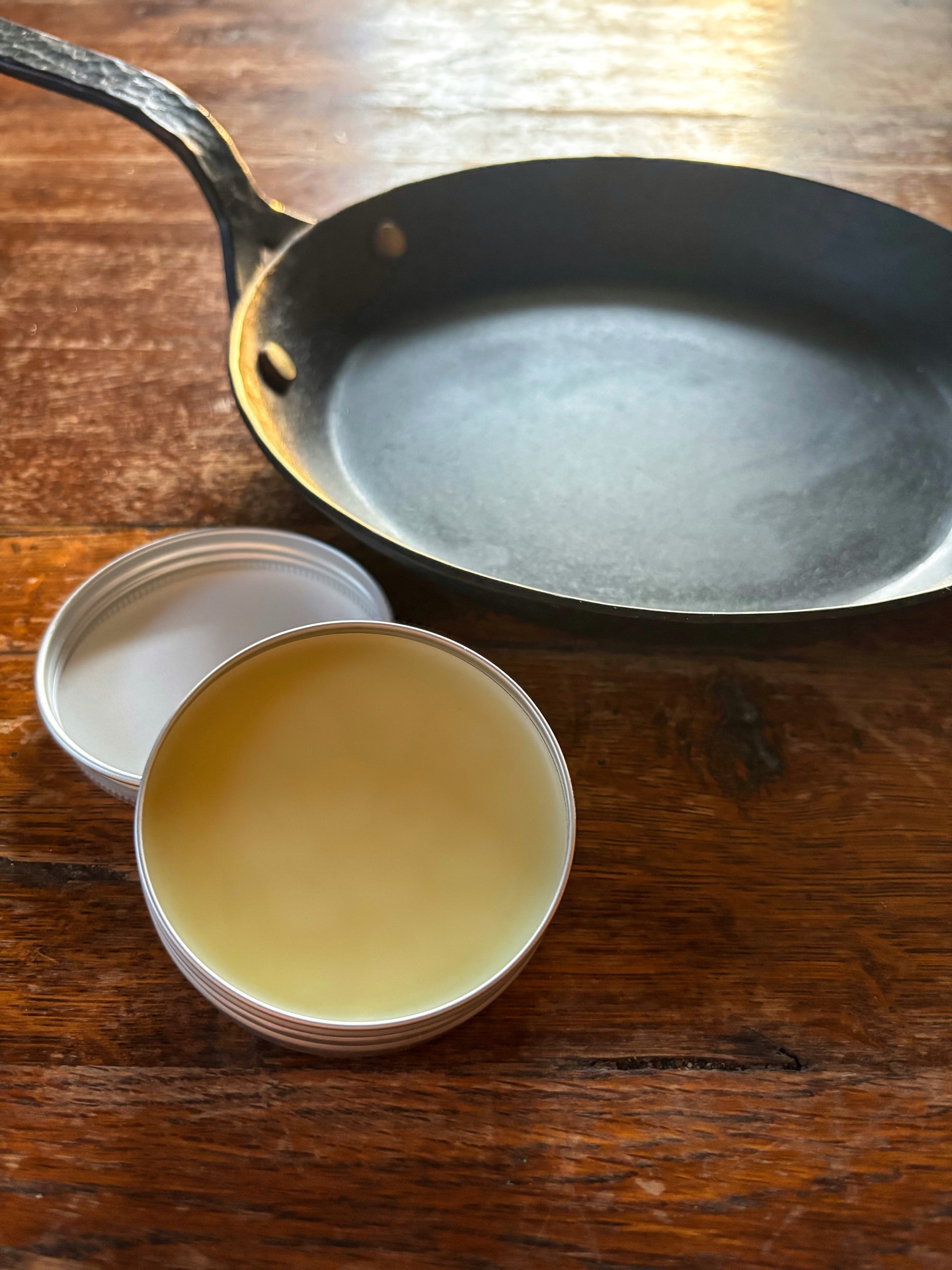 The first few tins of our ‘Seasoning Oil’ have been poured. Seasoning oil protects your carbon steel (+ cast iron) cookware and helps build a nonstick seasoning that will last generations