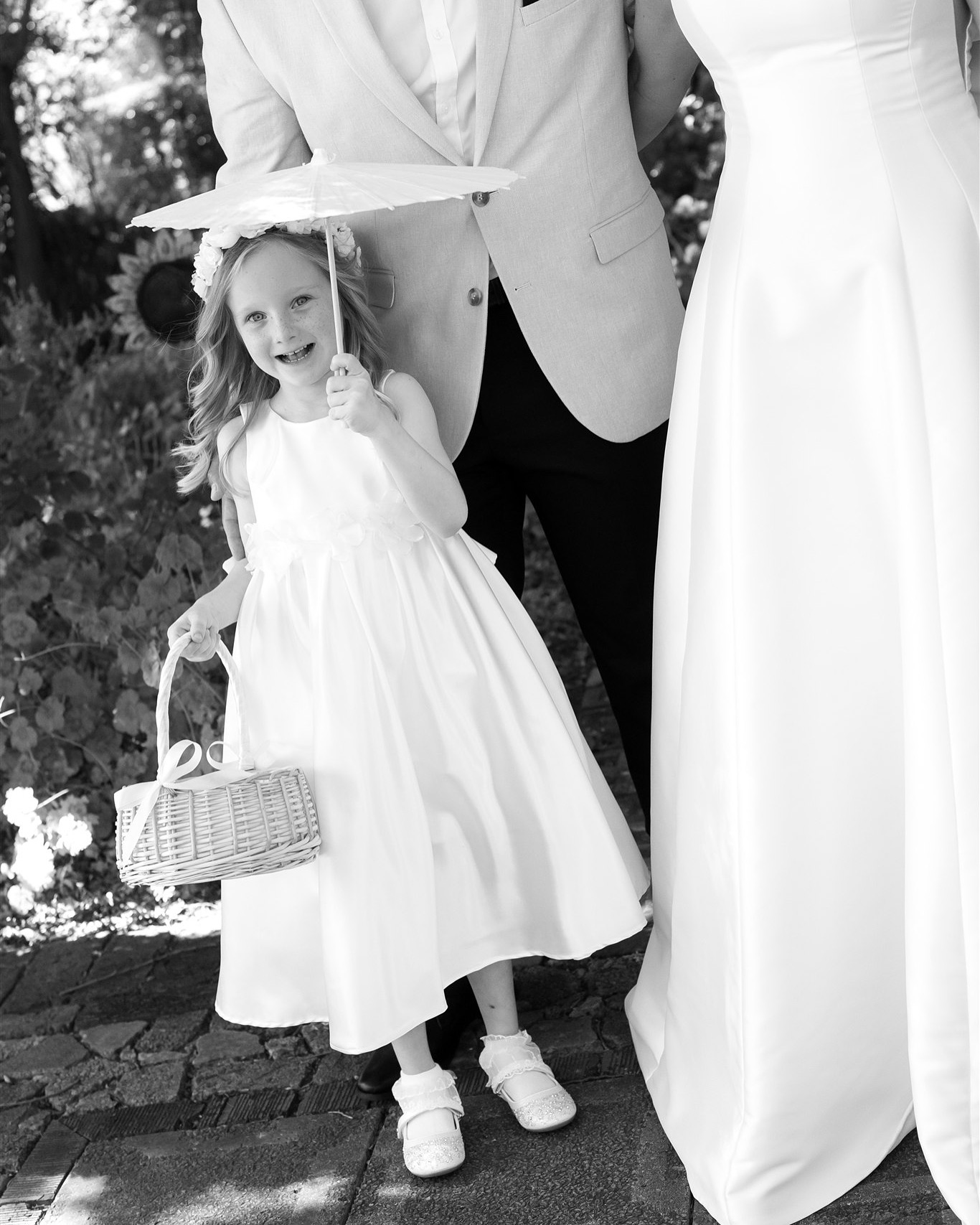 A wedding day is made up of so many micro moments that are constantly unfolding, we as photographers are constantly switched on to observe and sometimes even predict these little moments. Just like this one, we were about to take a family photo but our littlest member found some flowers on the ground, so of course his curious little heart had to take a look. Then his big cousin wrangled him up for the photo, all whilst grandma was watching and smiling at them ♥️