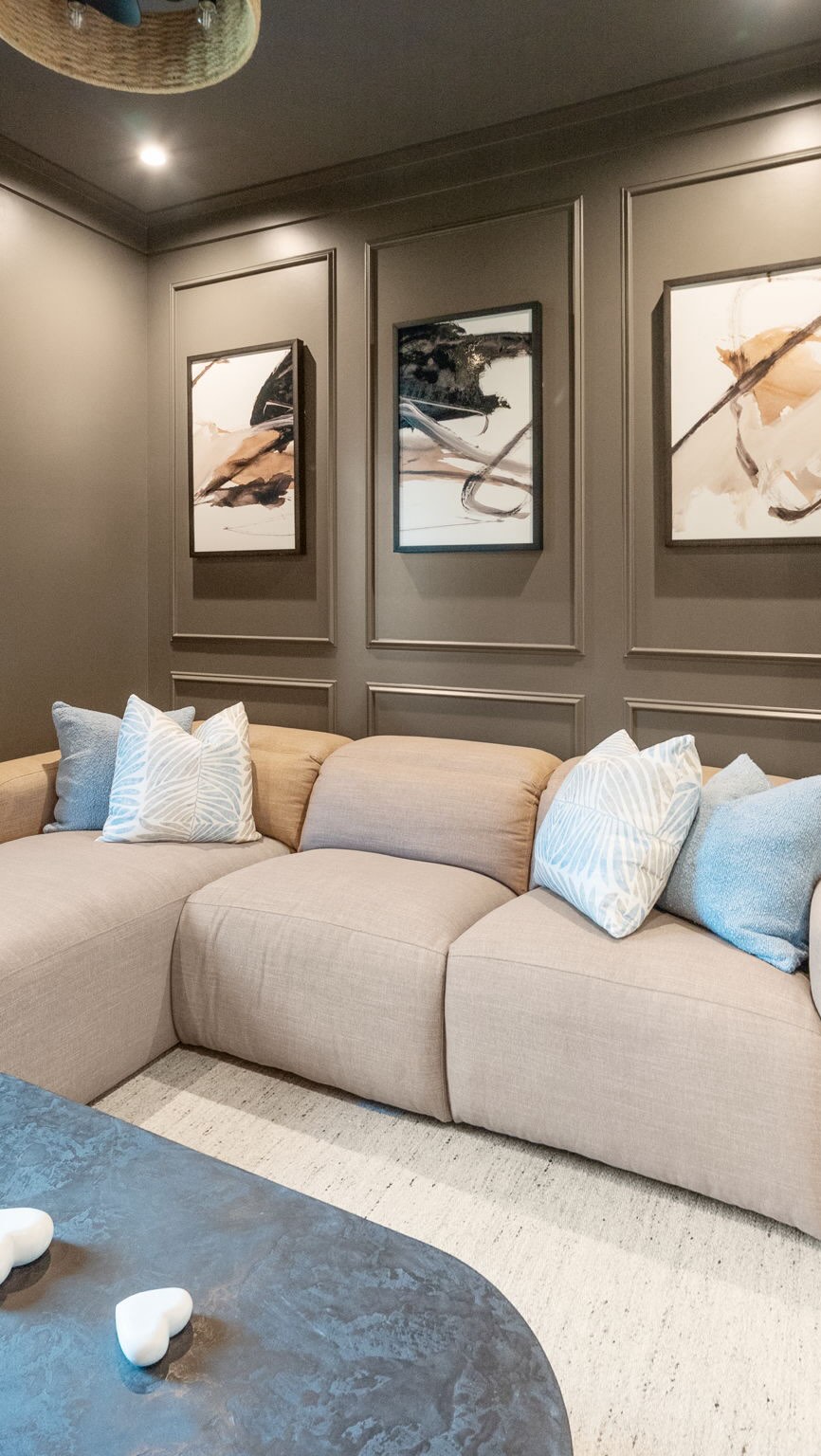 Color-drenched walls wrap the room in a rich, moody tone, creating a cocoon-like feel that’s perfect for unwinding and watching your favorite films. The paneled detailing adds subtle depth and sophistication without breaking the seamless look. Paired with a plush reclining sofa designed for ultimate comfort, this space invites you to sit back, stretch out, and settle in for a truly elevated movie night experience.
#interiordesign #interiordesigner #mediaroom #luxuryinteriors #seagrovebeach