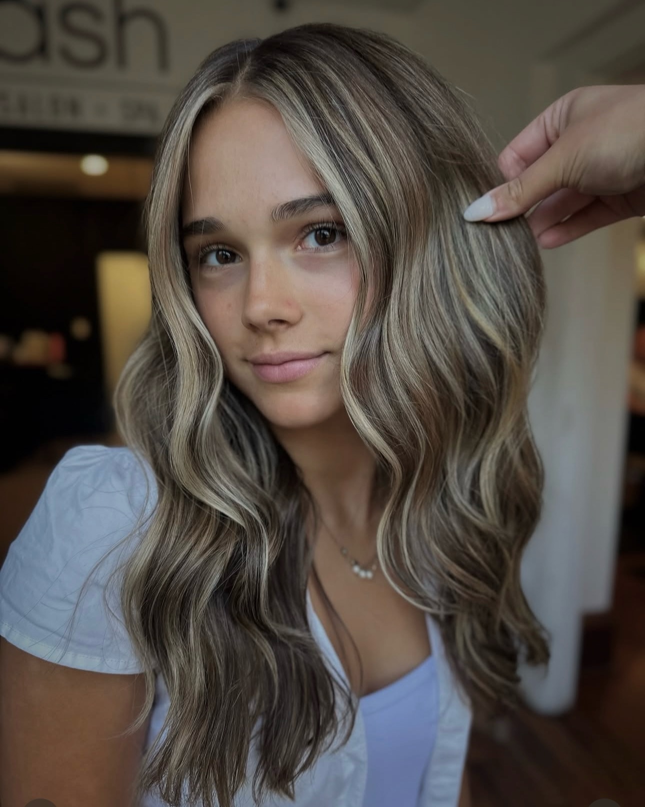 This gorgeous look by New Talent Jenna @styledxjmads was a full blonding with a money piece framing her face. If you just wanted the money piece and a few foils (up to 10) around the hairline to brighten you up, you would book our face framing service. All color services are explained in full detail on our website and are bookable online at salonash.com. As always, call us if you have questions!