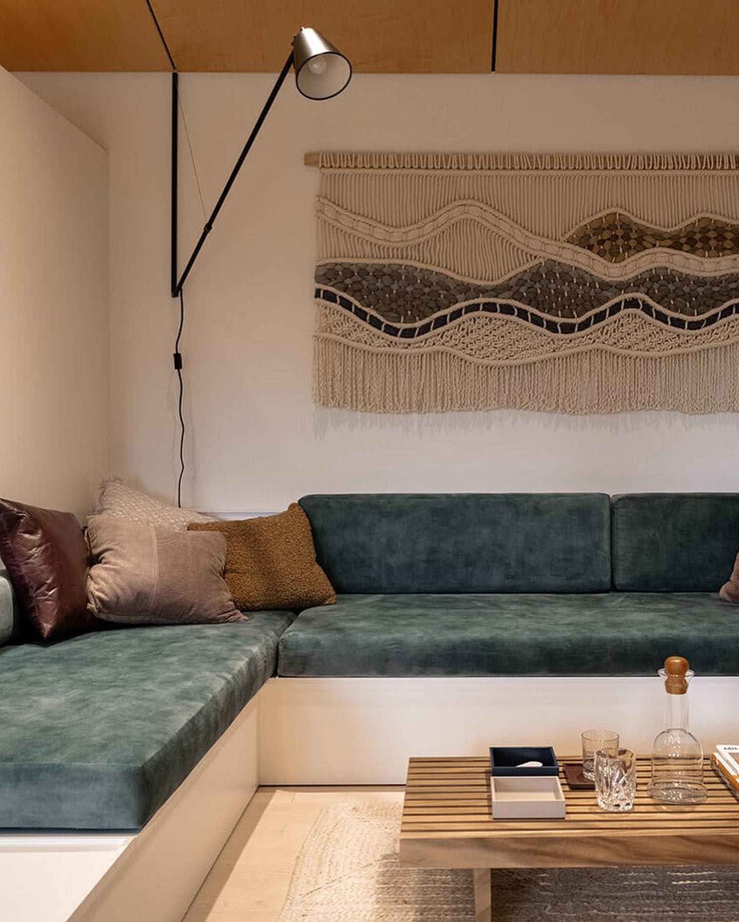 Can we please bring back the sunken conversation pits? This beautiful space by @wisemanandcromwell is everything! It was great working with them to create these beautiful spaces. Custom banquette cushions for the convo pit, and reupholstered mcm chairs for the dining area. Fabric: @tgi_fabrics Head over and check out the full design of #waterloomodern #remadefurnituretoronto #customupholstery #reupholstery #conversationpit #mcm