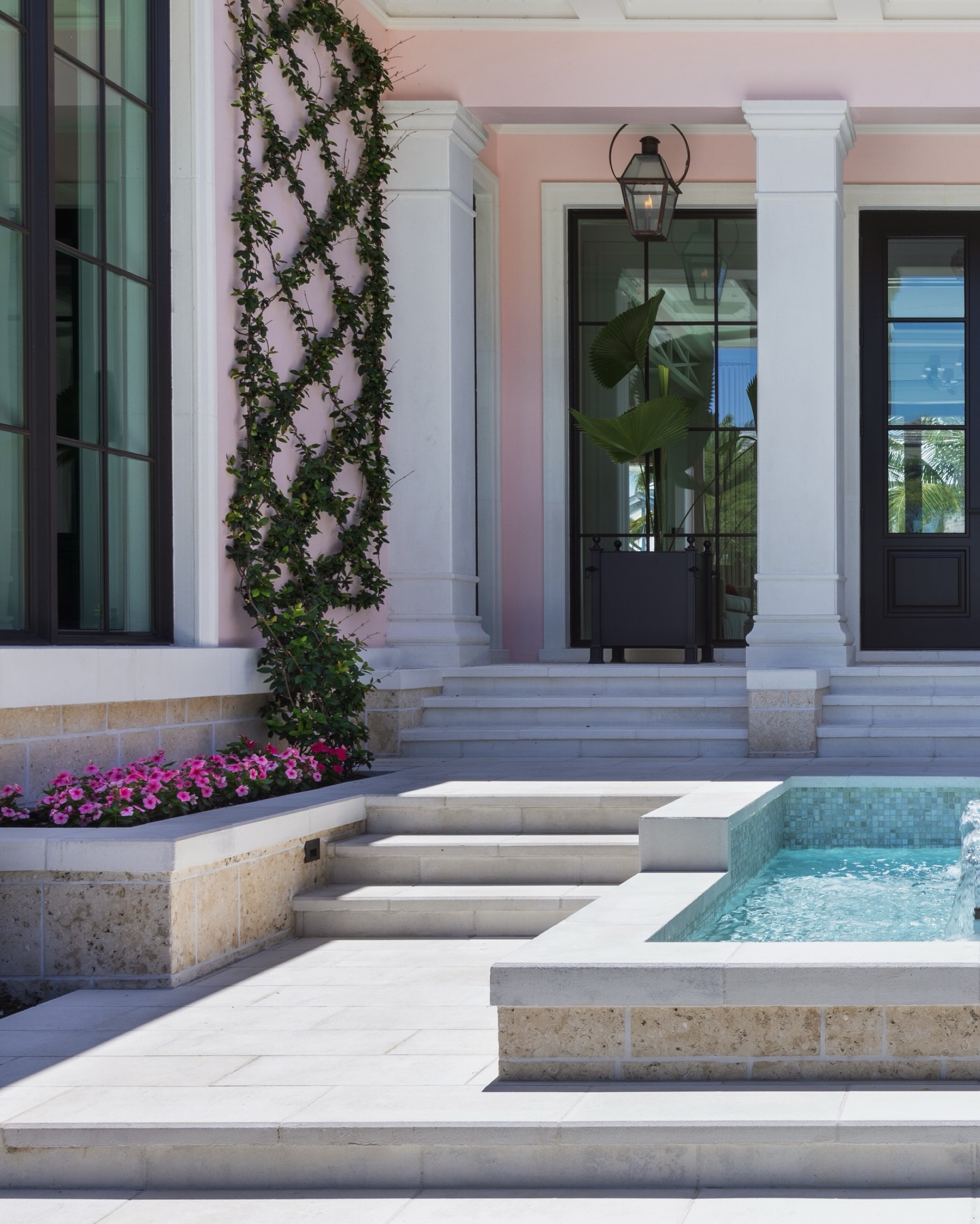 John Mellencamp approved 🩷
A pink house with a front entry designed to make an impression.
This architectural fountain creates a calm focal point, guiding you from the stepped arrival to the front doors with layered stone, gentle water sound, and perfectly framed greenery. The soft blush facade, classic columns, and reflective water work together to set a refined tone before you even step inside.
It’s not just an entrance, it’s an introduction to the home.
#LuxuryLandscapeDesign #NaplesFloridaDesign #HighEndLandscape #LuxuryHomeEntrance #FloridaDesign
