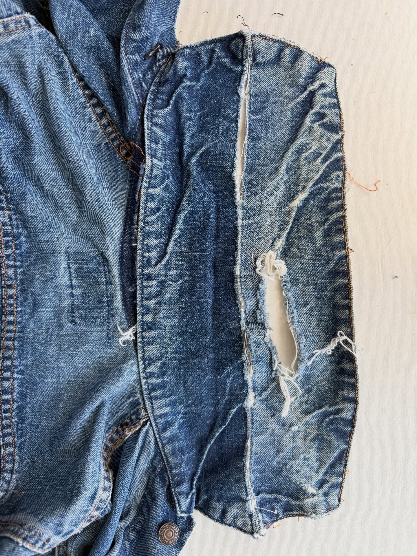 Before I share the (almost) finished jacket, I thought I’d share mid process. This isn’t a flashy mend; it’s not getting anything colorful or embroidered. It’s getting restored, restitched, and a couple simple patches.
When I first was gifted this jacket, I didn’t want to work on it because I felt like I didn’t have the skill. And I loved it so much, I didn’t want to screw it up.
But the more I mend, the more I realize how happy it makes me to bring things back to life, and how happy I am when I try something rather than wait (even if the outcome isn’t perfect).
Tomorrow I’ll share where the jacket is now.
#jeansrepair #visiblemending