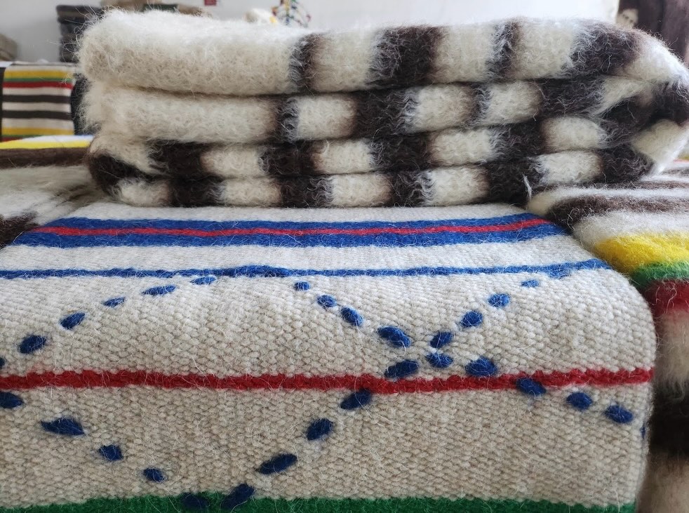 Sheep wool is integral to the identity of Serra da Estrela, and a handful of brands that use it have created a name for themselves in the design world. But there’s one that stands out for its hardcore artisanal production—the ancient “Cobertor de Papa” that originated near the city of Guarda. Though it sounds like it, there is no papal influence in the name, rather it’s a nod to the process of soaking the wool in water to the point that it looks like porridge (papa). Made from “churra do campo and mondegueira” wool, the blankets are handwoven on 300-year-old manual looms maintained by the Associação O Genuíno Cobertor de Papa. Originally used for capes and blankets to shelter shepherds, today this wool combo also wraps sneakers, notebooks and other accessories that can help reach a wider audience. We want to help, too, which is why we’re weaving it into our Wool Tours to support the work that is being done to protect this ancestral craft.
#portugal #wool #serradaestrela #tourportugal #guarda