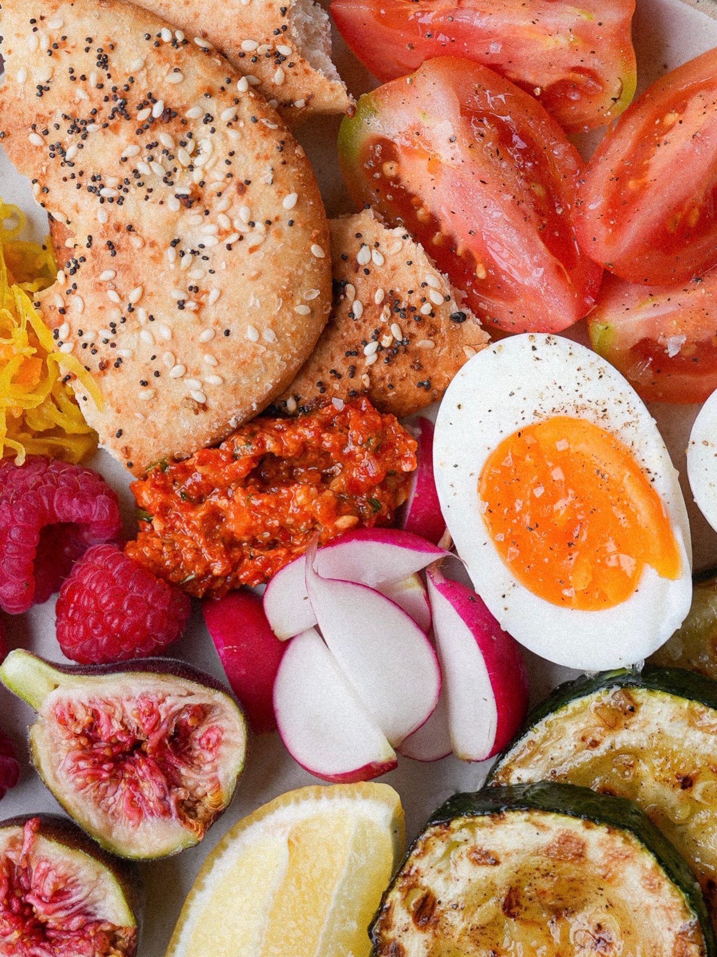 The last of the homegrown toms, the neighbours figs (!!), crisp radishes, sweet raspberries, sautéed zucchini, kraut, an everything bagel, a jammy egg and a dollop of romesco.