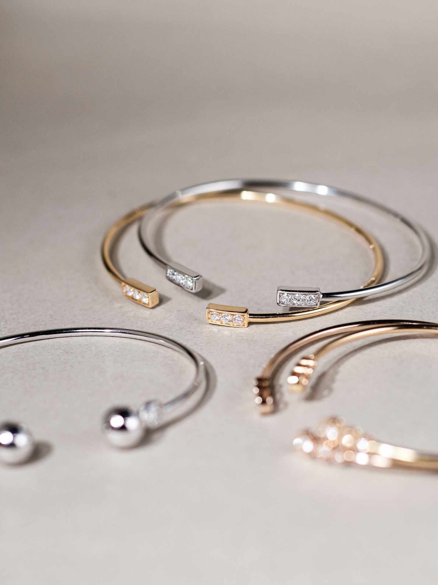 Diamond Bangle
Designed for both elegance and ease, our Diamond Bangle is crafted in K18 gold with a subtle flexibility for a seamless, comfortable fit.
Available in three distinct diamond-set designs, each piece offers a refined expression of brilliance—perfect for everyday wear or layering.
Wear it solo or stack it with our Tennis Bracelet for a fluid line of light. Enjoy our limited-time offer, available till 3 May at Ann Siang Hill Boutique. ✨