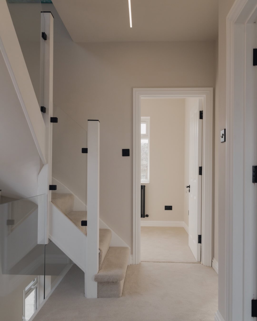 Windsor, complete.
Matte black fixtures and fittings throughout, creating contrast against the softer tones and cleaner lines across the house.
As part of the loft conversion, we also had the opportunity to increase the first floor ceiling heights from 2.4m to 2.6m. A subtle change, but one that makes the bedrooms feel noticeably lighter and more spacious.
SOHO Developments | High-end builds & Refurbishments