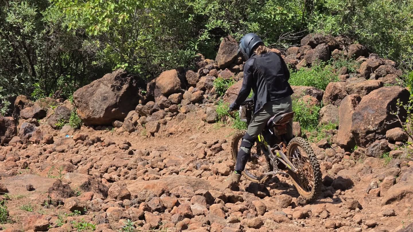 Negotiating rolling stones and steep slopes on the Surron #surronkenya #surronebike #ebikes #funandgames