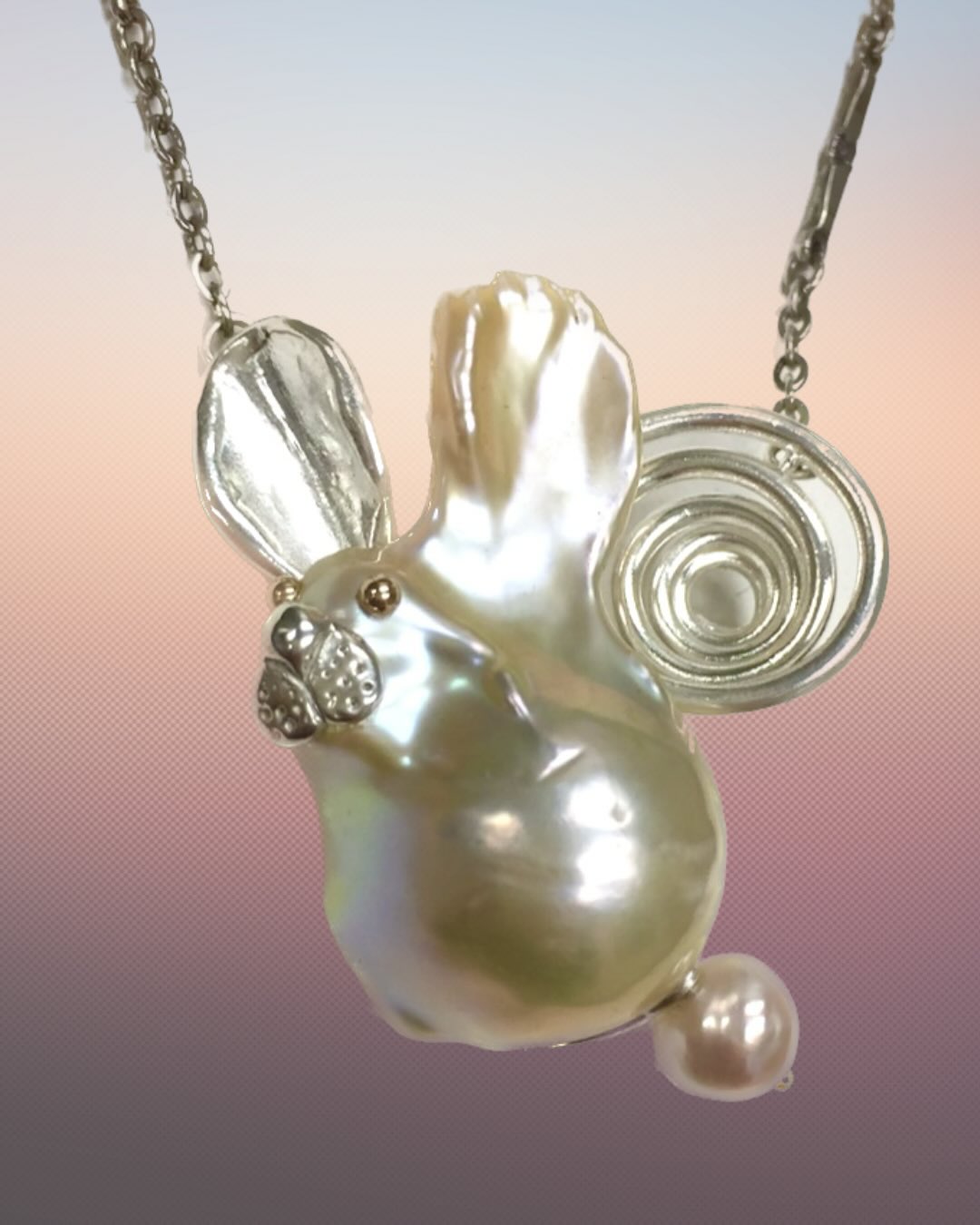 Happy Easter 🐣🐰! To celebrate today I’m sharing a bunny necklace I made in 2016 from a stunning baroque pearl complete with a silver rabbit hole and gold eyes. Swipe for more plus some Easter prep from this year!
✨
1. A bunny necklace crafted from an odd shaped baroque pearl complete with a swirling silver rabbit hole (inspired by Alice in Wonderland). The bunny has golden eyes and a nose, ear, and mouth crafted in sterling silver. Its tail is a smaller freshwater pearl.
✨
2. Process - trial and error. I made many different iterations of the ear and rabbit hole created from soft wax.
✨
3. 2026 Easter decorations- my collection of gemstone, porcelain and painted eggs.
✨
4. This years colorful dyed eggs
✨
5. Baking at my mom’s house on Good Friday. We make traditional Easter pies.
✨
6. My favorite meal is the Pizza con Erbe- an escarole and salty mix of capers, anchovies, olives, and yellow raisins. Message me for the recipe.
✨
7. Pastiera di grano- grain pie, ricotta, sugar and eggs.
✨
8. My Good Friday jewels - a mix of painted wooden egg charms, my great aunts watch locket, and a tassel
✨
9. Easter Nails - speckled egg nails on my daughter
✨
10. The escarole mix before it gets baked on the pizza
.
.
.
.
#mejiajewelry #eastertraditions #rabbitjewelry #easterjewelry #italiantraditions