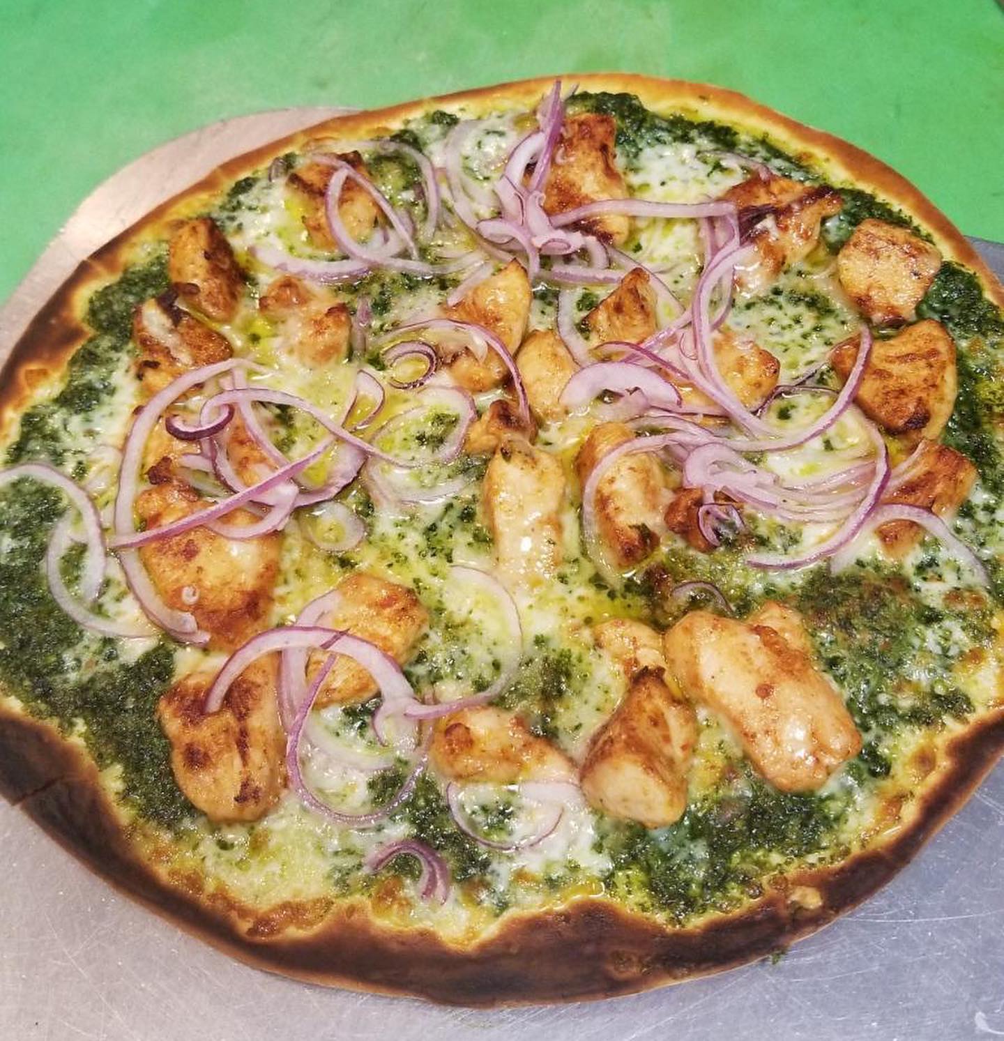 This delicious pizza was prepared by the very talented chef of @juliieats using our fresh Genovese basil. Yum!!