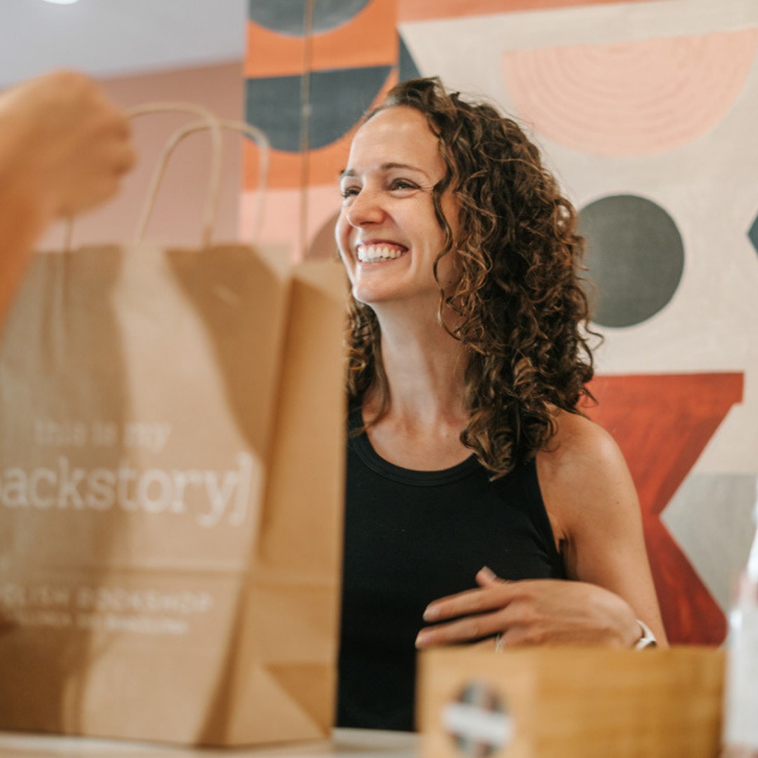 We get asked a lot: what kind of bookshop are you?
Here's our answer:
We're curated, not exhaustive. We're not Am*zon. We won't have every English book ever printed — but we will have a delightfully hand-picked selection of things we (and you) love, in a space that makes you want to come in and stay a while. A place to discover, not just to buy.
We're curious. About books. About people. About local culture. Come with your questions, your doubts, your to-read lists — and maybe leave with the answer to all three.
We're community. Book clubs, silent reading parties, author events, workshops, storytime, collabs with local businesses — and the kind of place where strangers become regulars become friends.
And we're friendly — genuinely, proudly so. Nothing makes us happier than a review that mentions the vibe, the staff, or the fact that someone walked in not knowing anyone and left feeling completely at home. That's the whole point, really.
Come for a book. Stay for everything else. - Kate & Abbie