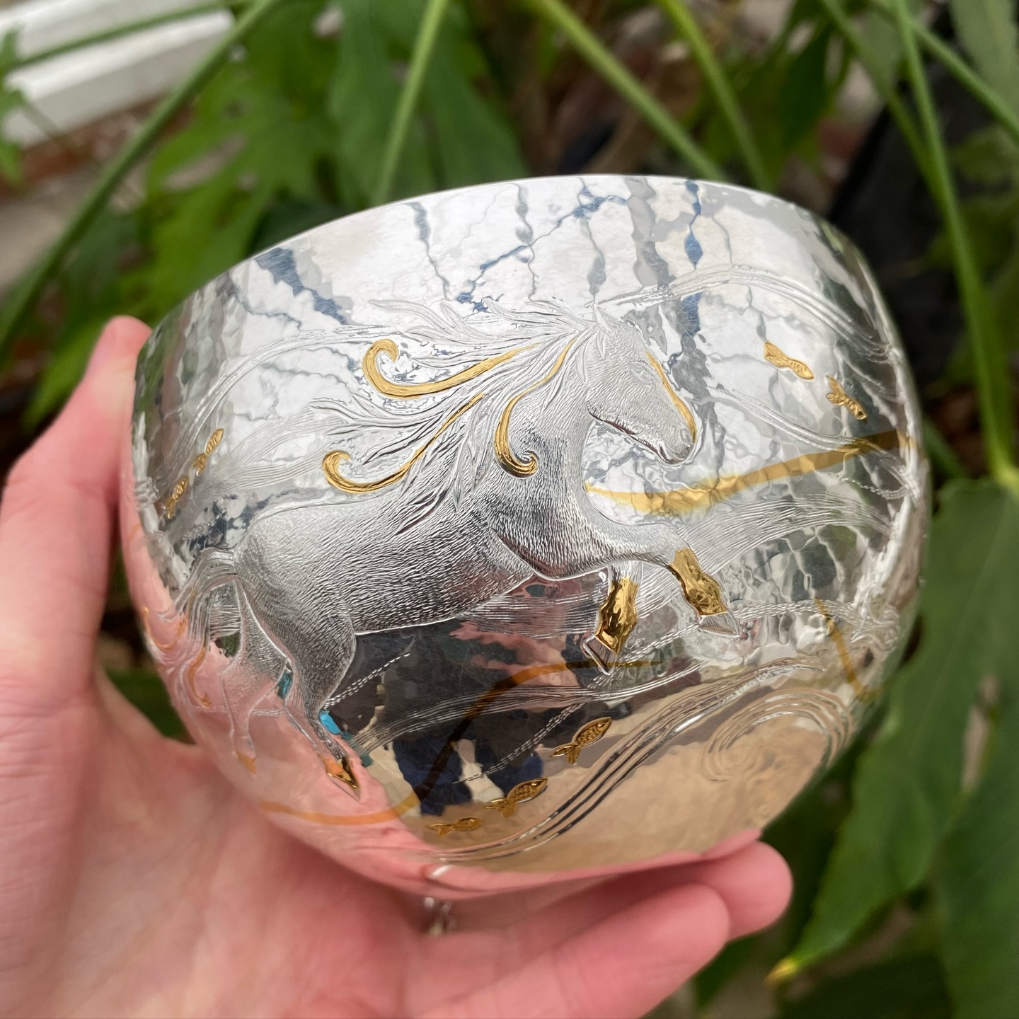 Kelpie Bowl 🌊
One of my recent commissions that I particularly enjoyed creating was the Kelpie Bowl. Inspired by the client’s horse, Kelpie, I wanted to capture a fairytale-like scene — with Kelpie swimming through swirling water, fish darting between flowing currents, and touches of gold weaving through the waves.
I hand-raised the bowl from a flat sheet of silver into its final form before applying the detailed decoration. Using chasing and repoussé, I worked from the inside to gently push Kelpie forward from the surface, giving the figure a subtle sense of movement and depth. The bright gold on the inside really makes this piece come alive, and further acts as shimmering water with the design coming through on the inside.
#silverbowl #commission #chasingandrepoussé #handmade #silvercommission