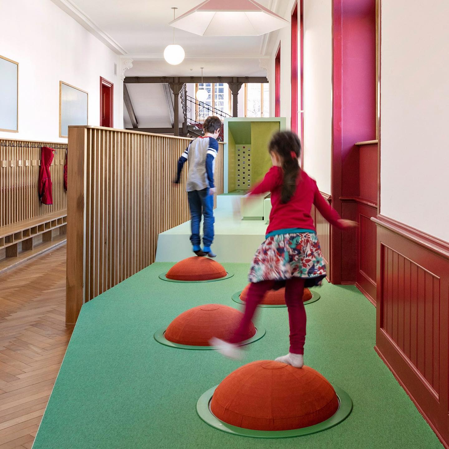 Corridor spaces are perfect spaces for play and we love this example by Swiss design studio ZMIK. The designers have thoughtfully transformed the corridors at a primary school into flexible learning-spaces designed to promote a sense of wellbeing.
The terraced learning landscape provides an array of playful moments where children can hide, climb, jump and retreat for a peaceful moment away. This is a beautiful example of play being embedded into a learning environment, allowing children to be physically active and express their full creative capabilities. The space allows allows children to have agency over their learning environment, choosing how and where to learn.
.
.
Project: Learning Scapes
Designers: @zmik_spatialdesign
Location: Basel, Switzerland
Photos: Weisswert, Basel
.
.
.
#citiesforplay #playfulcity #childfriendlycity #play #learningthroughplay #urbandesign #placemaking #publicspace #urbanplanning #citymaking #urbanchildhoods #citylife #urbanista #planning #citylab #citiesforpeople #playmatters #playfullearning #learningenvironment