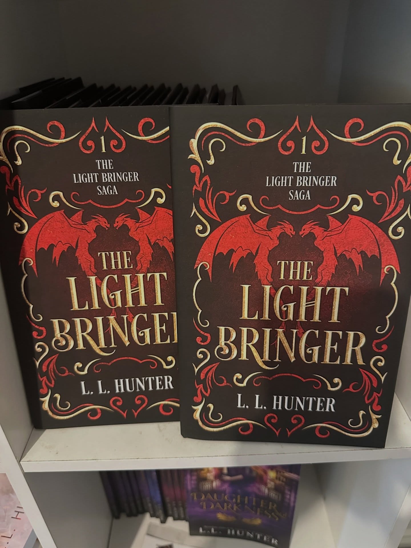 2 signed hardback copies of The Light Bringer plus swag will soon be available for sale at new bookstore @heatandheartstrings
