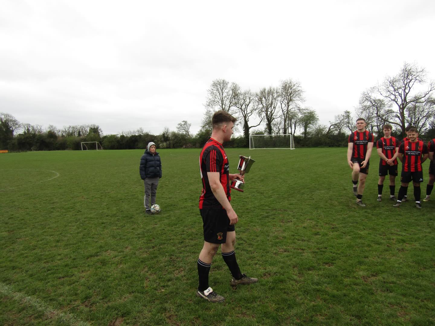 Clane United Football Club being presented with the KDFL U20 Premier Division trophy