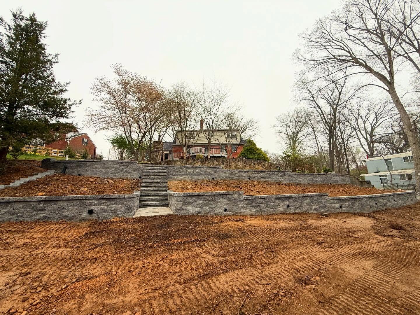 Belgard Anchored Diamond paver blocks to create a two terrace garden wall.