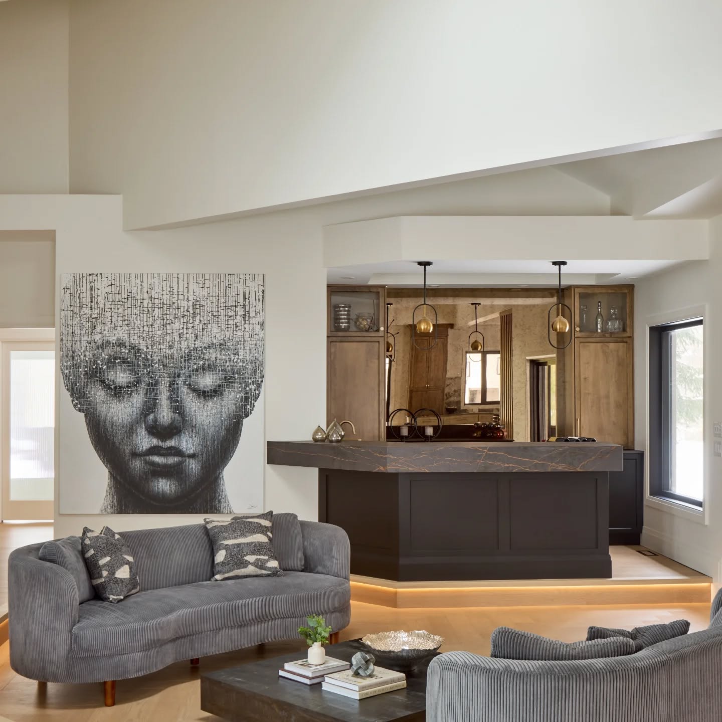 The Living Room Bar at #ProjectVista was one of my favourite spaces in this home. Designed for clients who love to entertain, it naturally evolved into a central hub perfect for gathering, conversation and a little bit of 'wow'.
Featuring striking Dekton counters paired with an antique glass backsplash, this space balances richness with warmth. The sunken living room is finished with a herringbone wood floor, thoughtfully illuminated to enhance both ambiance and function.
Every detail was considered with the clients lifestyle at the forefront. Because great design isn't just beautiful, it's meant to be lived in.
