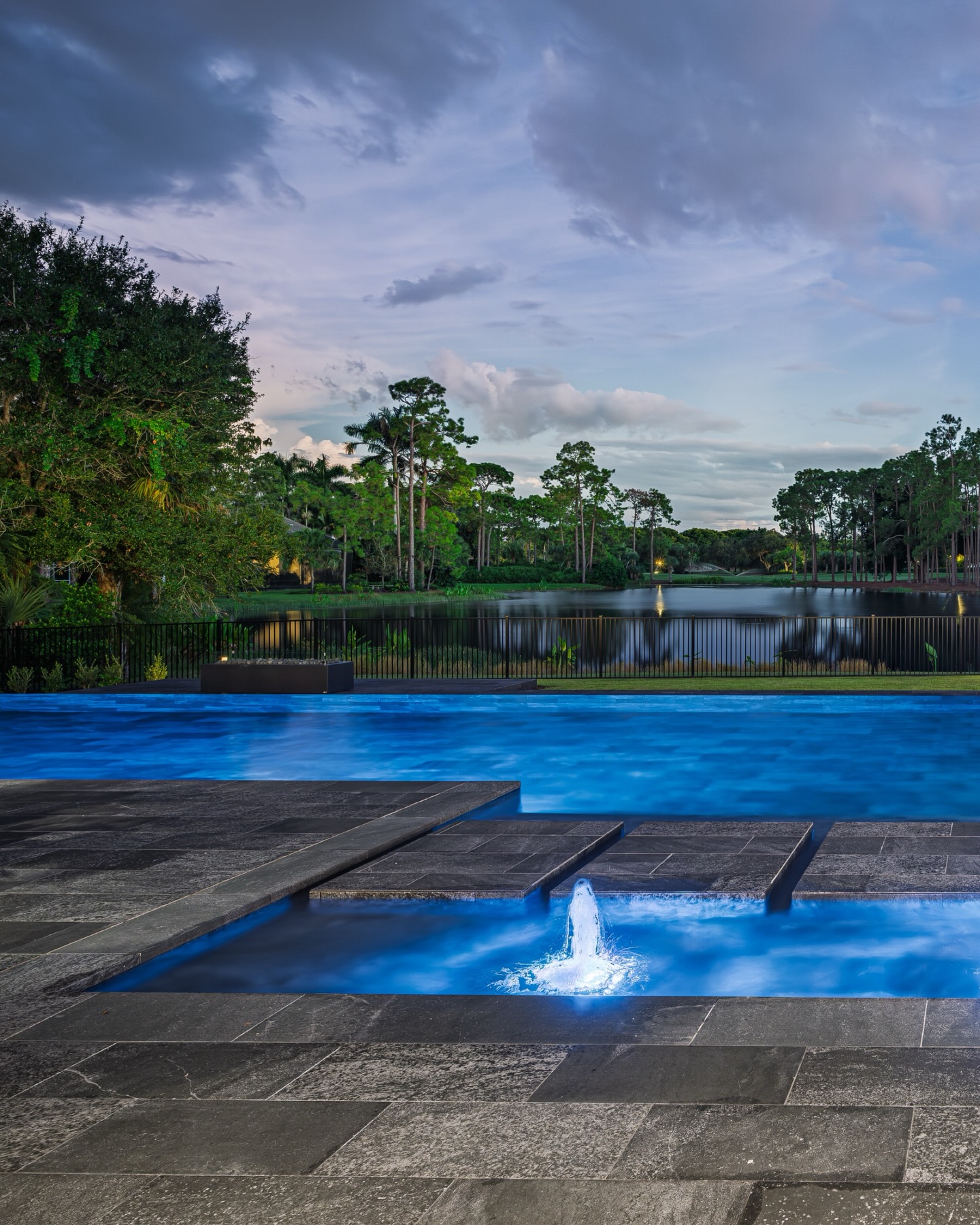 Evening settles in and the water begins to glow ✨
A quiet path of stone draws you across the surface, softened by the rhythm of lit bubblers beneath your feet. Beyond, the lake opens wide, reflecting the last color in the sky as the landscape fades into calm.
Designed for the moments after the day ends, when the space feels entirely your own.
#LuxuryOutdoorLiving #CustomPoolDesign #NaplesFLHomes #WaterFeatureDesign #BoutiqueLandscape