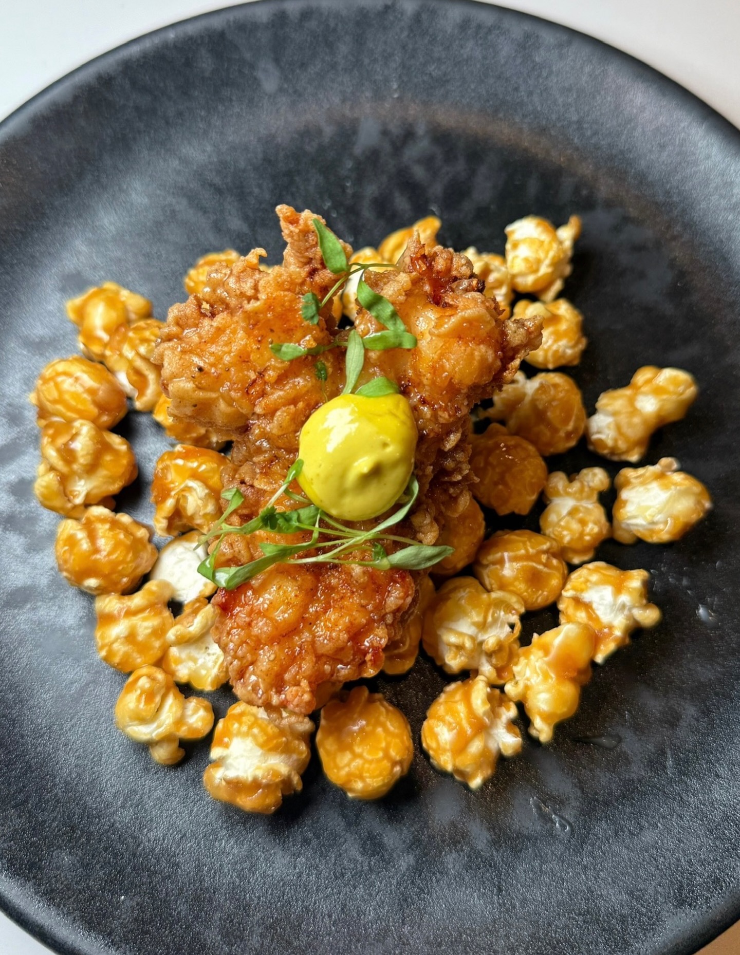 Something new has entered the appetizer lineup: The Flash Fried Lobster - juicy and perfectly fried lobster tail layered over caramel popcorn with baby cilantro and a lemon pepper aioli, it’s the kind of starter you don’t forget, pull up and try it for yourself. Happy Sunday Baltimore.