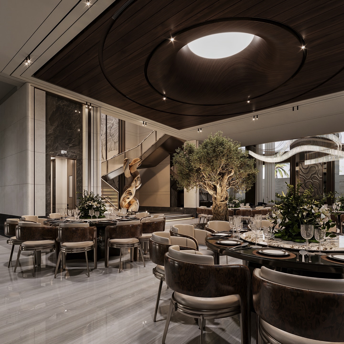 Not just a dining space this is an experience.
Designed as a seamless open hall, the space flows effortlessly from the entrance to the living area and lift lobby, creating a sense of continuity rarely seen. The composition balances warmth and precision rich wood ceilings, sculptural elements, and refined materials layered to craft a truly elevated atmosphere.
At the heart, a timeless olive tree becomes the soul of the space, grounding the design with natural elegance while everything around it speaks the language of modern luxury.
A dining setting in Riyadh that goes beyond function into pure spatial expression. ✨🌿