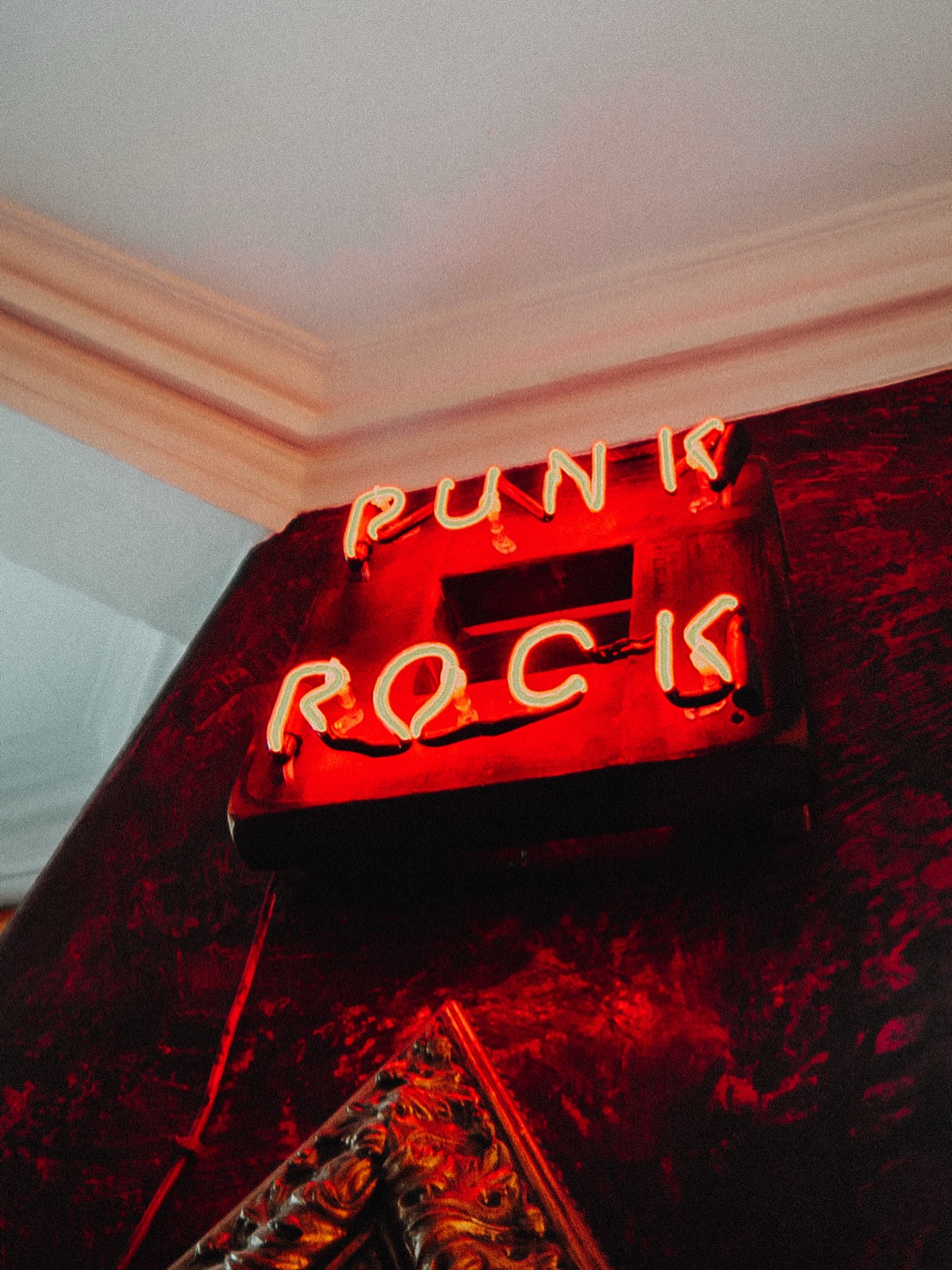 Born in the gritty streets of London and New York City in the mid-1970s, punk rock exploded as a raw, rebellious response to social frustration, economic struggle, and a bloated music industry.
Bands like Sex Pistols, The Clash, and Ramones stripped music back to its core, fast, loud, and unapologetically honest. Sticking their middle fingers up at the establishment and the man.
More than just a sound, punk became a cultural movement, fuelling DIY ethics, anti-establishment attitudes, and bold self-expression through fashion, art, and identity.
From torn clothes and safety pins to independent record labels and zines, it empowered anyone to create without permission.
Decades later, punk’s influence still echoes across global music scenes, shaping genres from alternative rock to grime, and inspiring generations to challenge norms, speak out, and stay authentically loud.