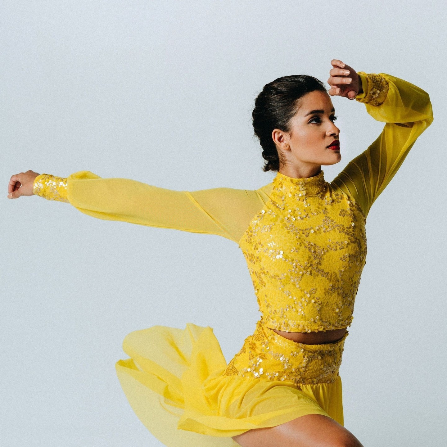 ✨Our exquisite "Elegant" yellow sequin collection is all about spreading joy! ✨ Explore the stunning "Kayla" Top + "Giselle" Hilo Skirt showcased here. This exceptional sequin fabric can be made-to-order in most of our styles. What can we create for you?!? #dancecostumes #dancer #costumes