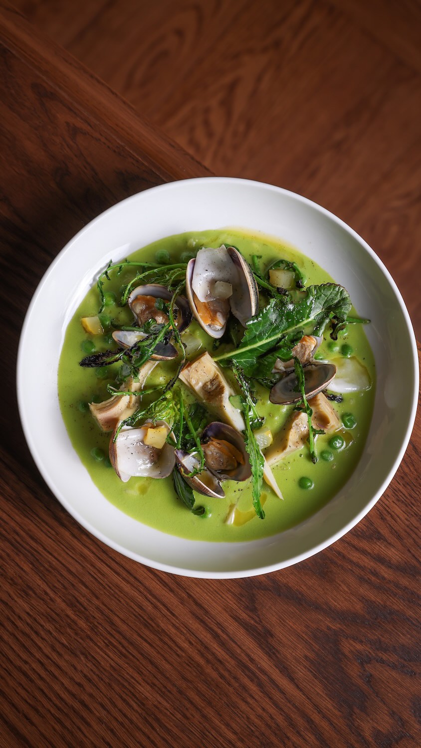 Green Rice & Fired Clams. Charred brassicas, artichokes, sweet peas & lardo di Colonnata.
“It’s not a risotto, it’s a rice dish with a lot else going on.”
Let Evan tell you more about this new dish.