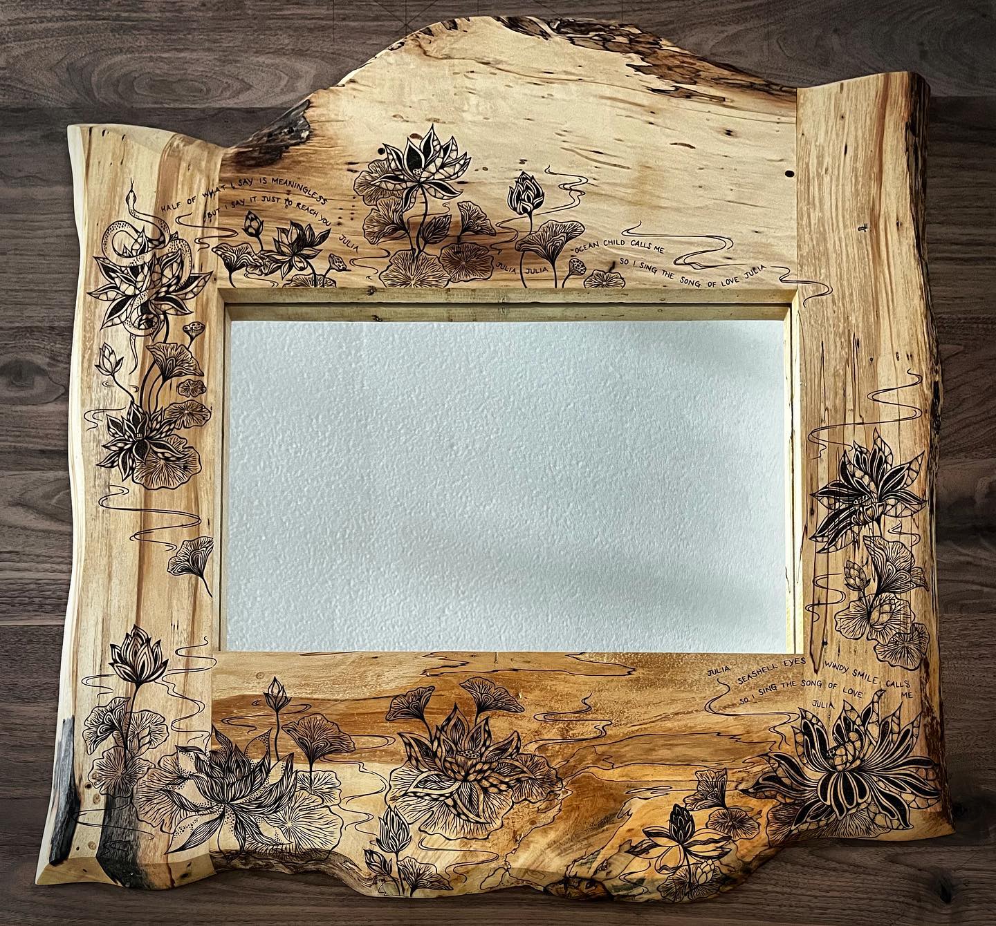 One of my favorite projects I’ve done so far! This 30”x30” custom mirror challenged and inspired me this summer. Live edge spalted maple with lotus flowers, snakes and song lyrics ✨
.
.
.
.
.
#kcapurasdesign #pyrography #pyrographyart #pyrographyartist #woodart #woodartist #woodburning #woodburningartist #woodburningart #woodporn #burnedbyhand #freehand #mirror #woodcraft #originaldesign #oneofakind #femalewoodworker #naturalstyle #homedecor #boho #bohohome #statementpiece #wallart #artofinstagram #artporn #michigan #localartist @razertip @odiesoil