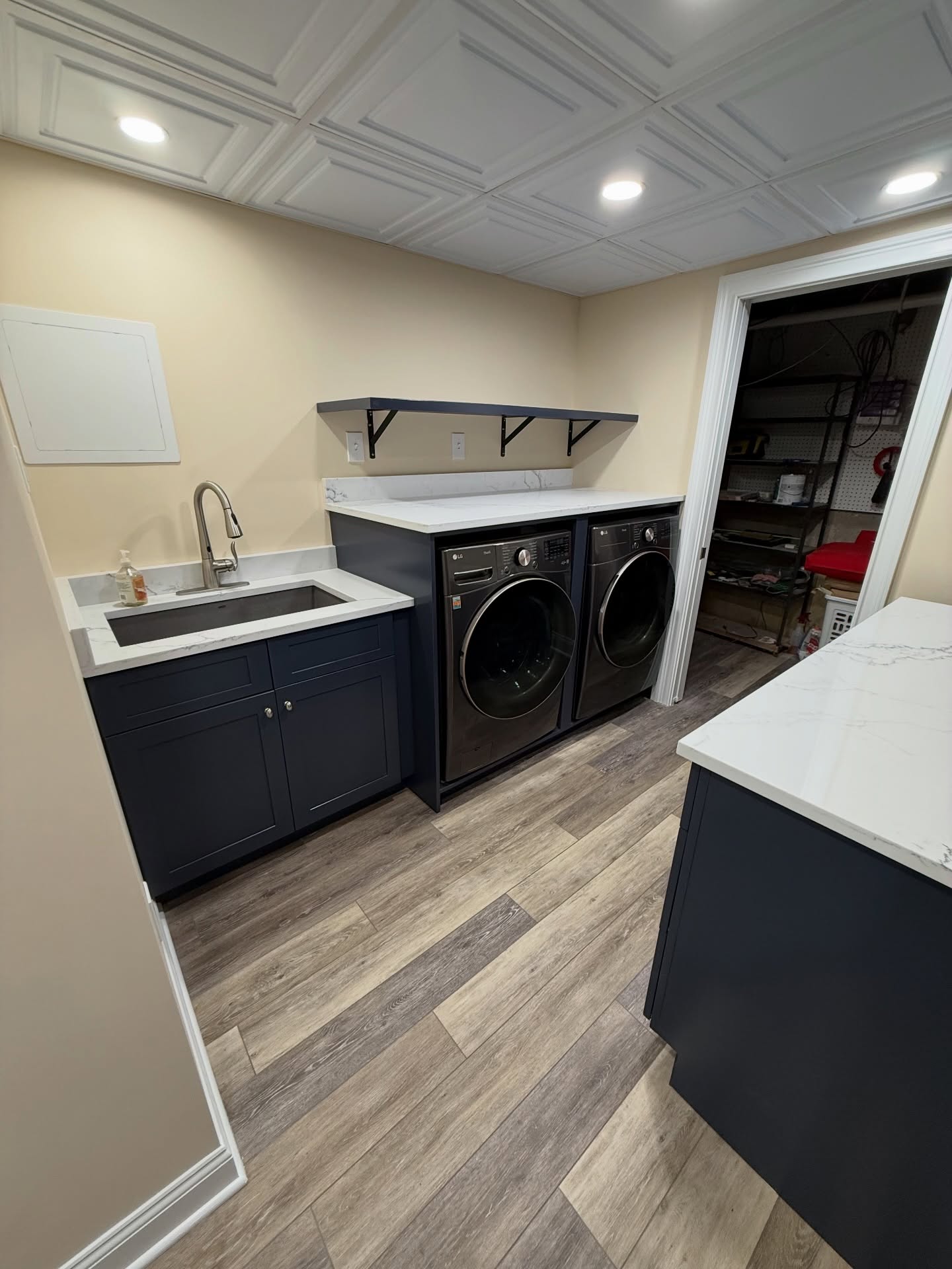 Who says laundry can't be fun in a bright and colorful space! Added storage and functionality were priorities when we revamped this basement laundry area and powder room. The blue cabinetry and bright paint, paired with pistachio green cabinetry in the bathroom, make it a bright and cheerful spot. 203-778-9385
#laundryroommakeover #laundryroomremodel #basementrenovation #designbuildcontractor #homeimprovementproject
