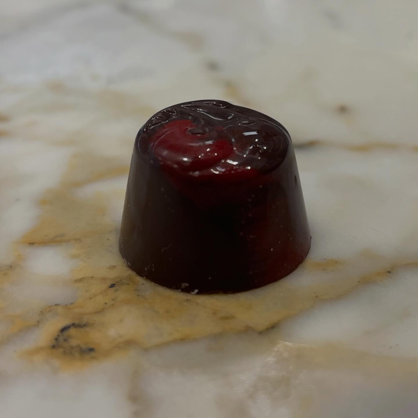 🌟 Truffle Feature 🌟 The Cherry Cordial 🍒
Our booziest truffle and one of our top sellers, the Cherry Cordial will both melt in your mouth and fill it with a full cocktail! With its brandies cherry in the center and liquid fondant wrapped in rich dark chocolate, it is bound to please your tastebuds!
#cherrycordial #stargazerfinechocolatesandcoffeebar #denverchocolate #artisanalchocolate #denvershop