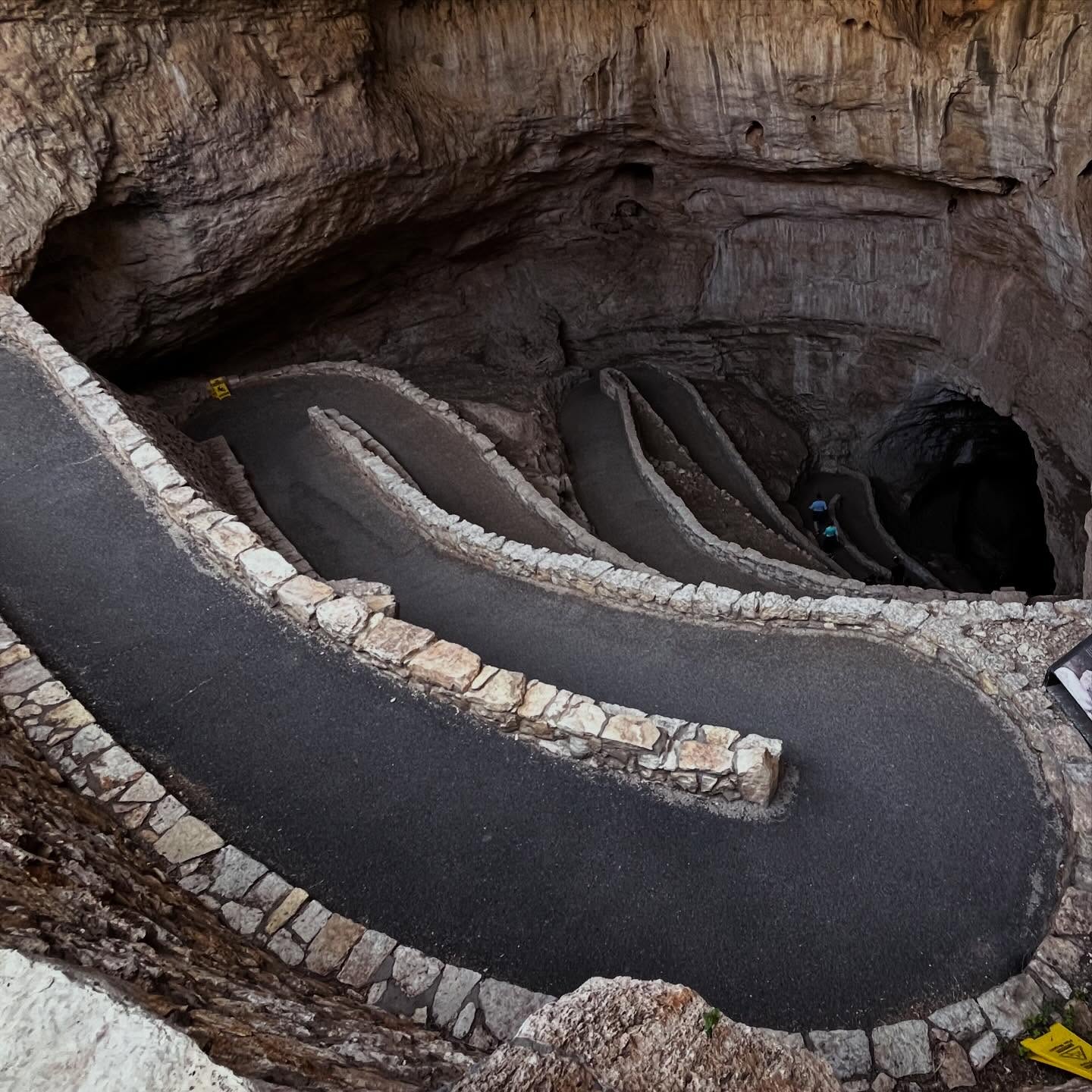At the natural entrance of Carlsbad Caverns National Park, it’s impossible not to think about 16-year-old cowboy Jim White. In 1898, he spotted what he thought was black smoke pouring out of a mountain and rode his horse closer to investigate. But when he got there, he realized it wasn’t smoke at all—it was millions of bats spiraling out of the cave. 🦇🐎
Curious, he climbed down into the darkness…and ended up discovering one of the most incredible places in the world. Standing here, you can almost imagine what that moment must have felt like. 🌎✨
#CarlsbadCaverns #NationalParks #TravelStory #AdventureAwaits #ExploreMore
