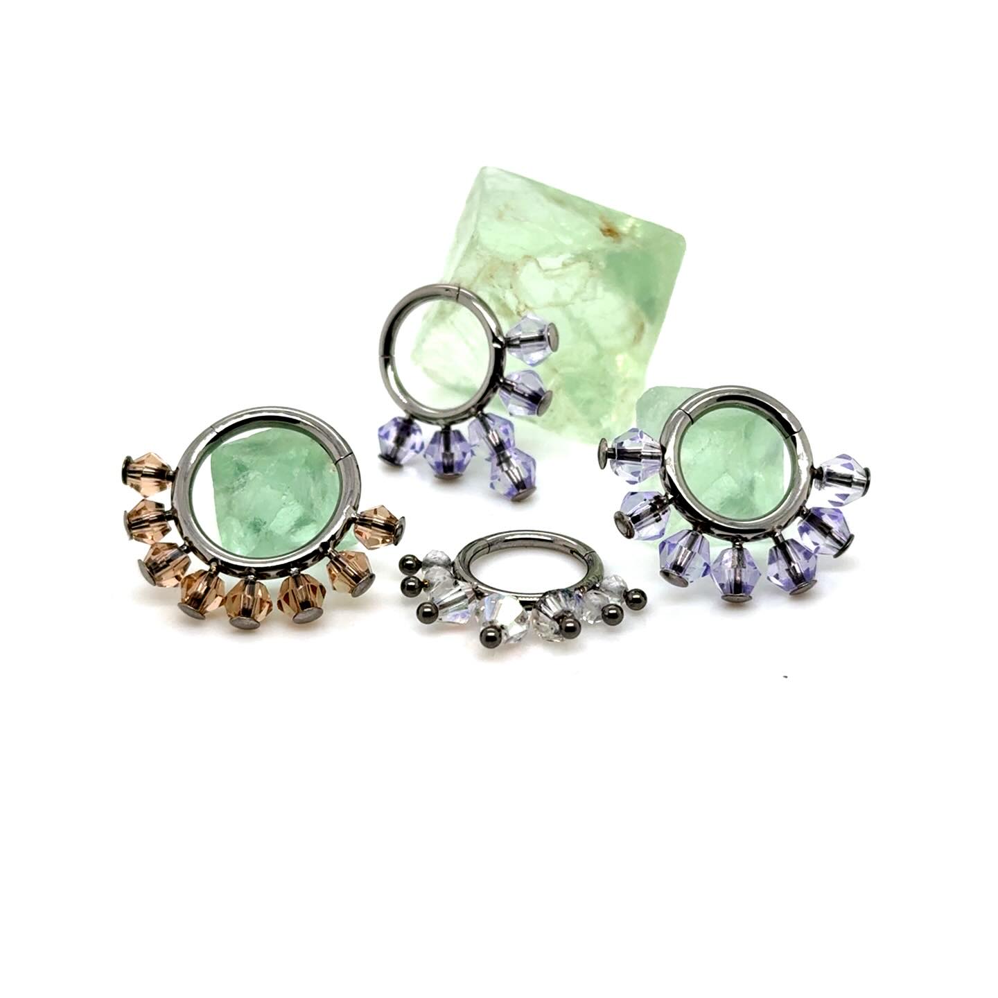 Introducing our Glass Crystal Titanium Hinged Clicker product line. More details will be available soon when we decide on the design m variations. Different Glass colors/ combinations and anodizing will be available for almost an infinite variety of combinations. #septum #septumpiercing #septumjewelry #safepiercing #bodypiercing